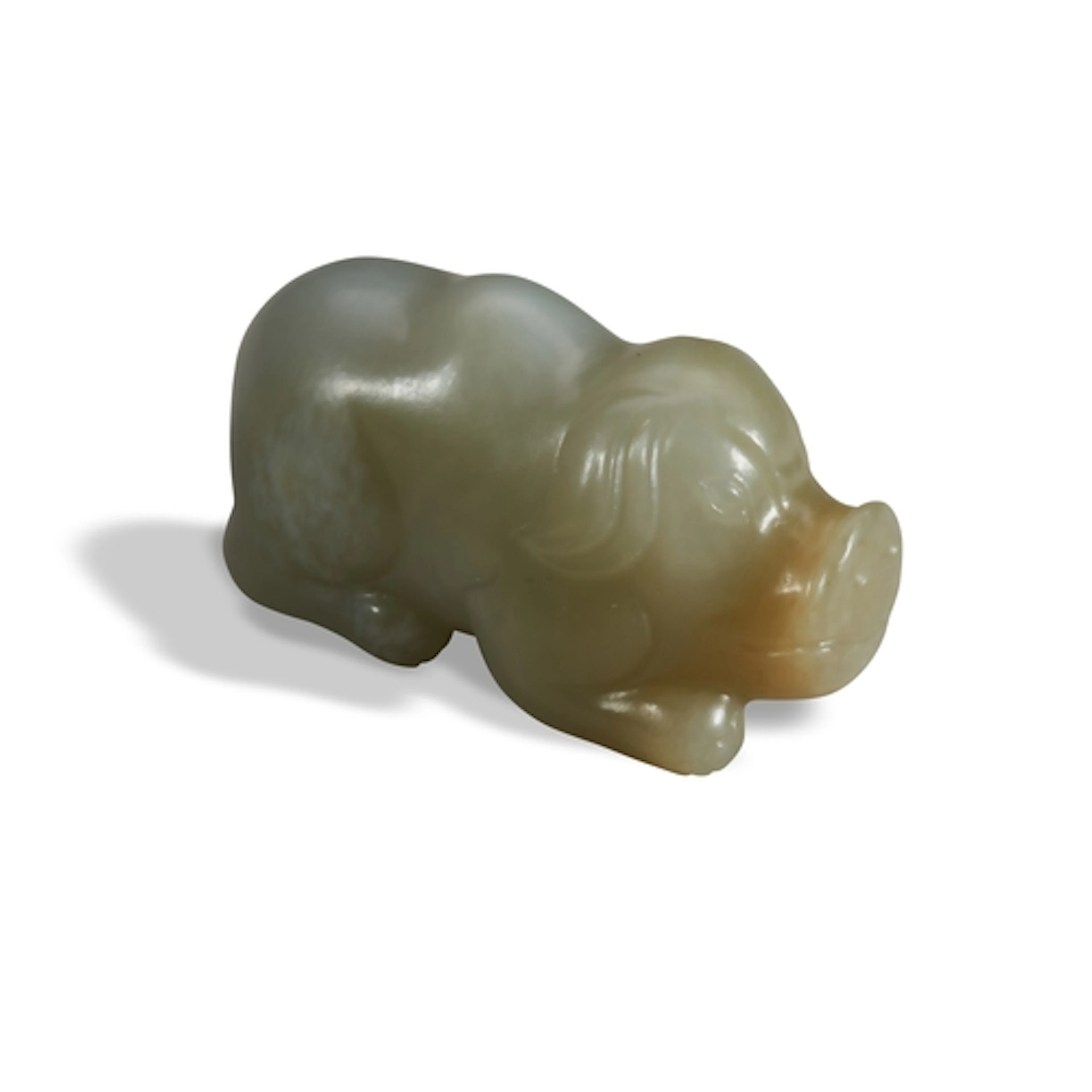 A CELADON JADE CARVING OF A PIG QING DYNASTY, 19TH CENTURY 青...