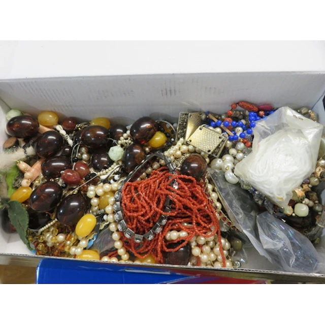 Five boxes containing a quantity of various costume jeweller...