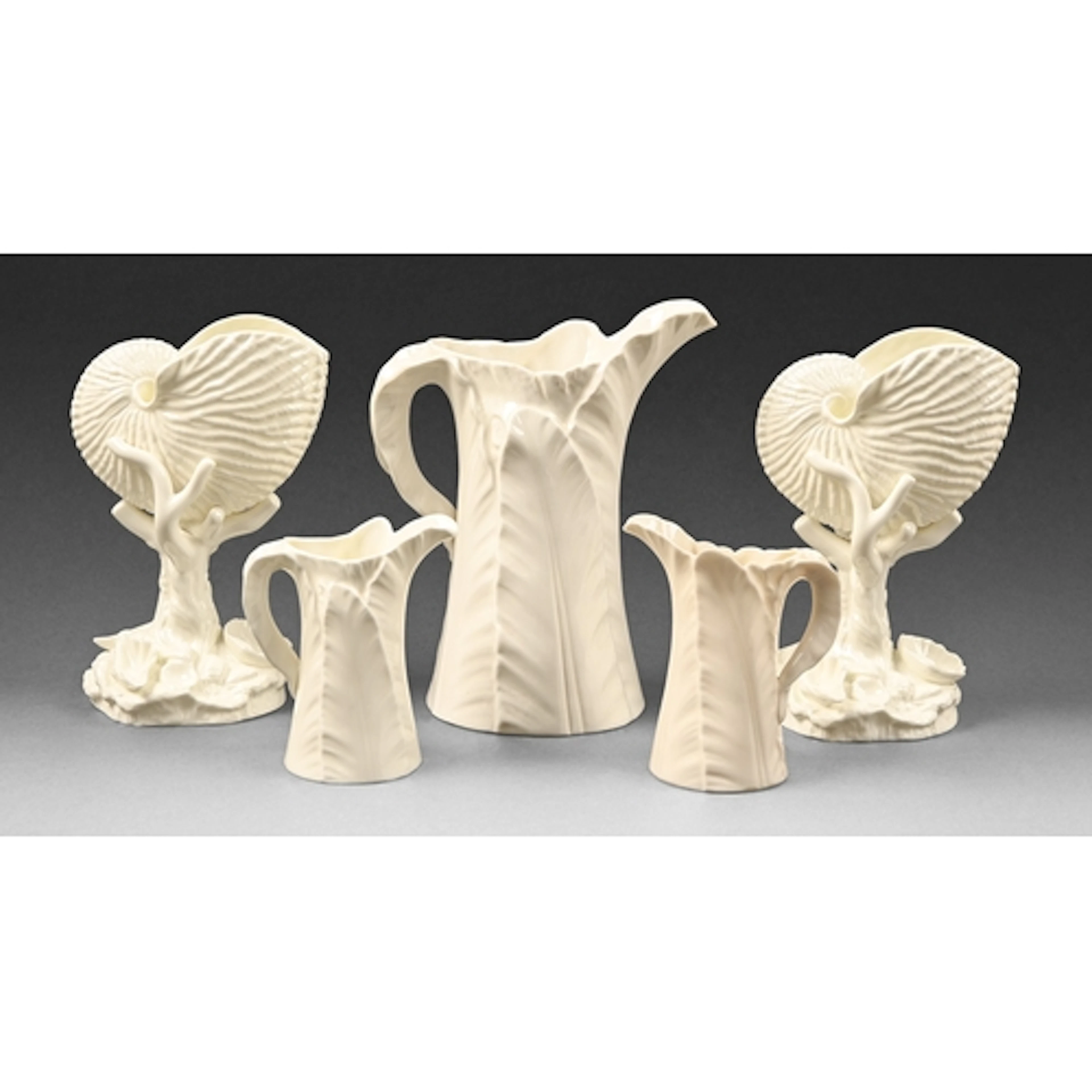 A pair of Royal Worcester nautilus shell vases and three lea...