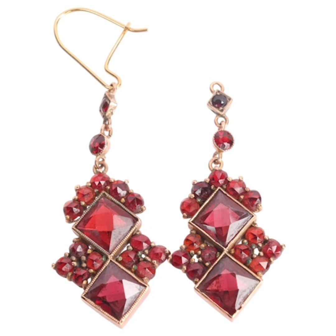 A pair of Bohemian garnet drop earrings, set with square and...