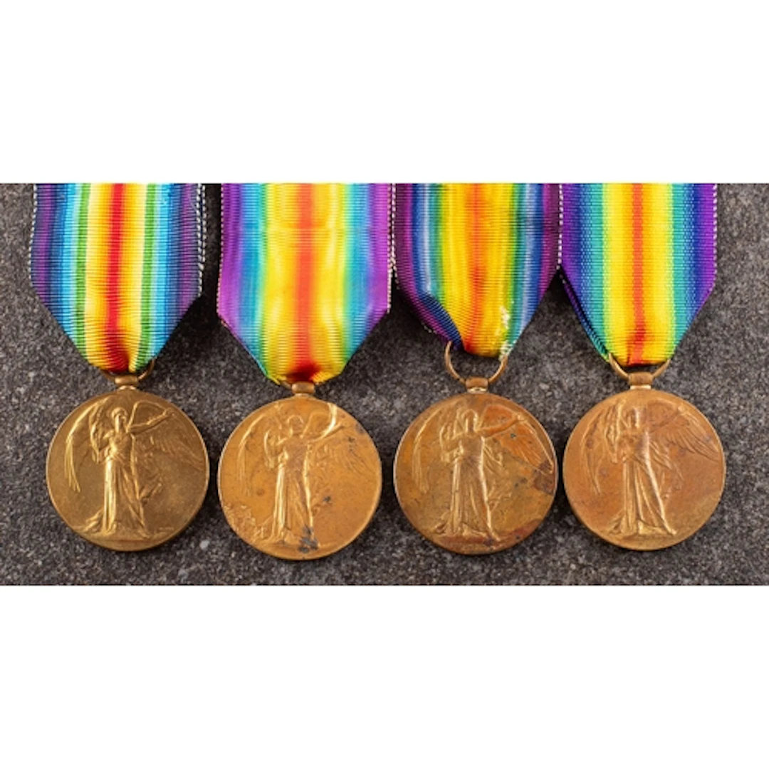 Four George V Victory Medals. 'TS-902 Pte A J Owen ASC' '32...
