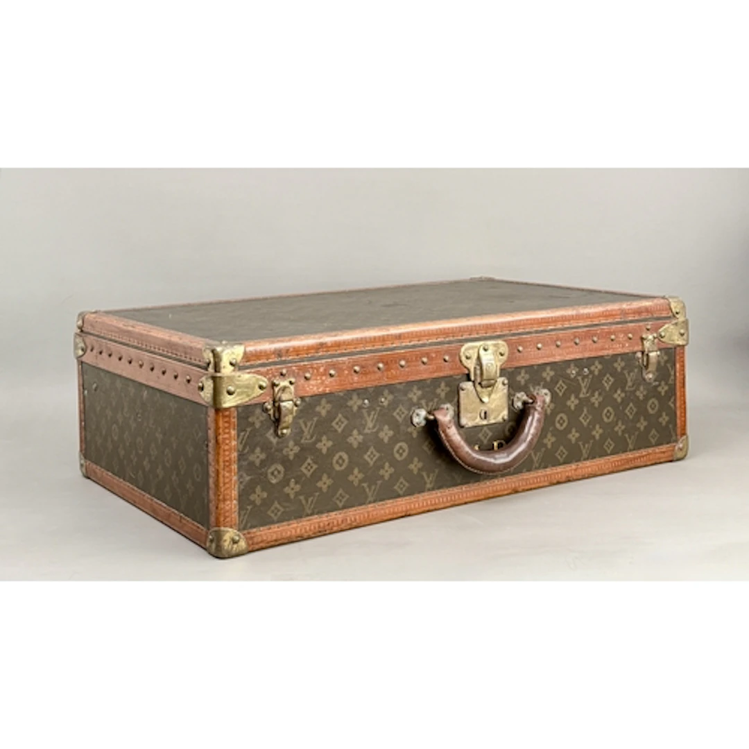 A Louis Vuitton hard sided suitcase - c.1920's, covered in L...