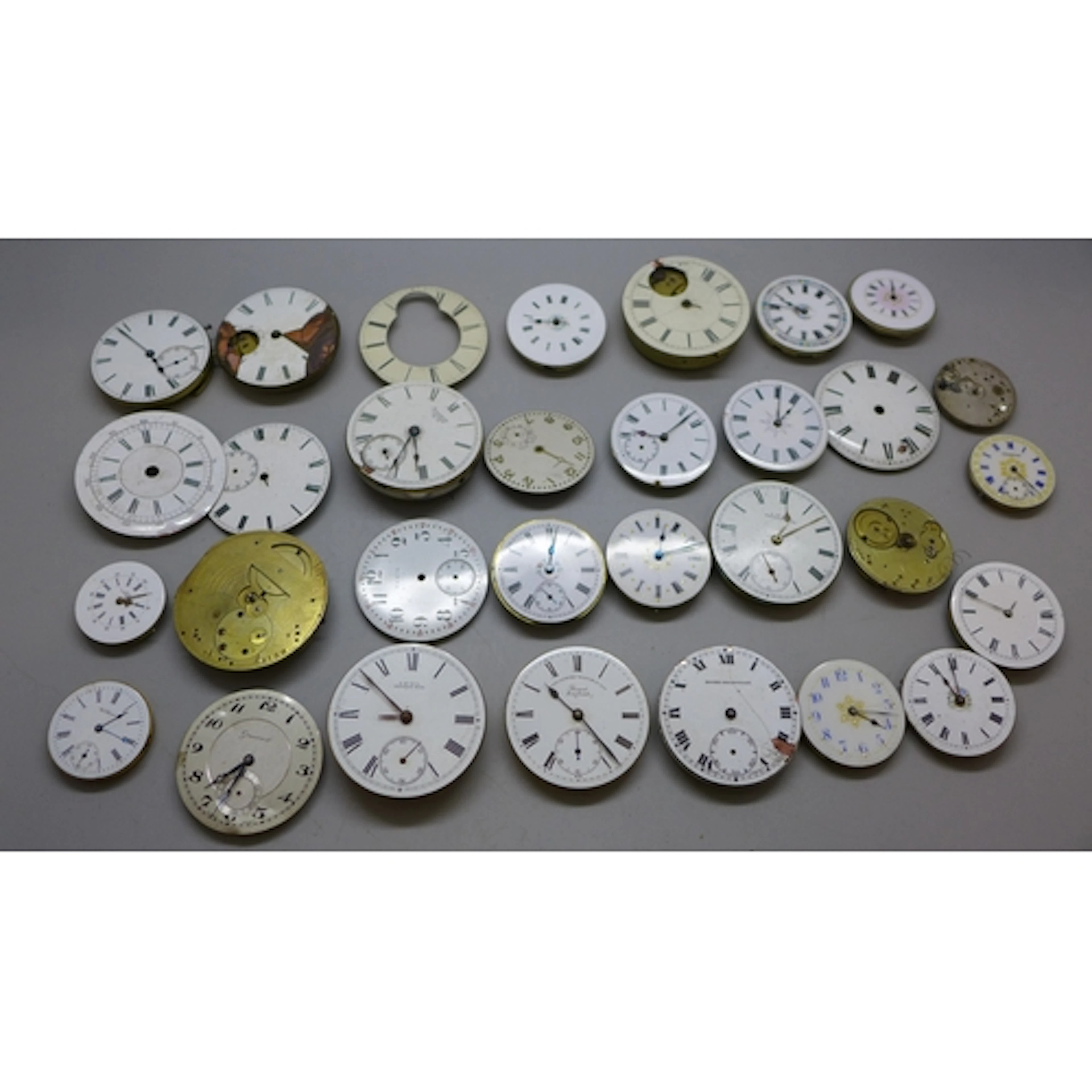 A collection of pocket watch movements including an example ...