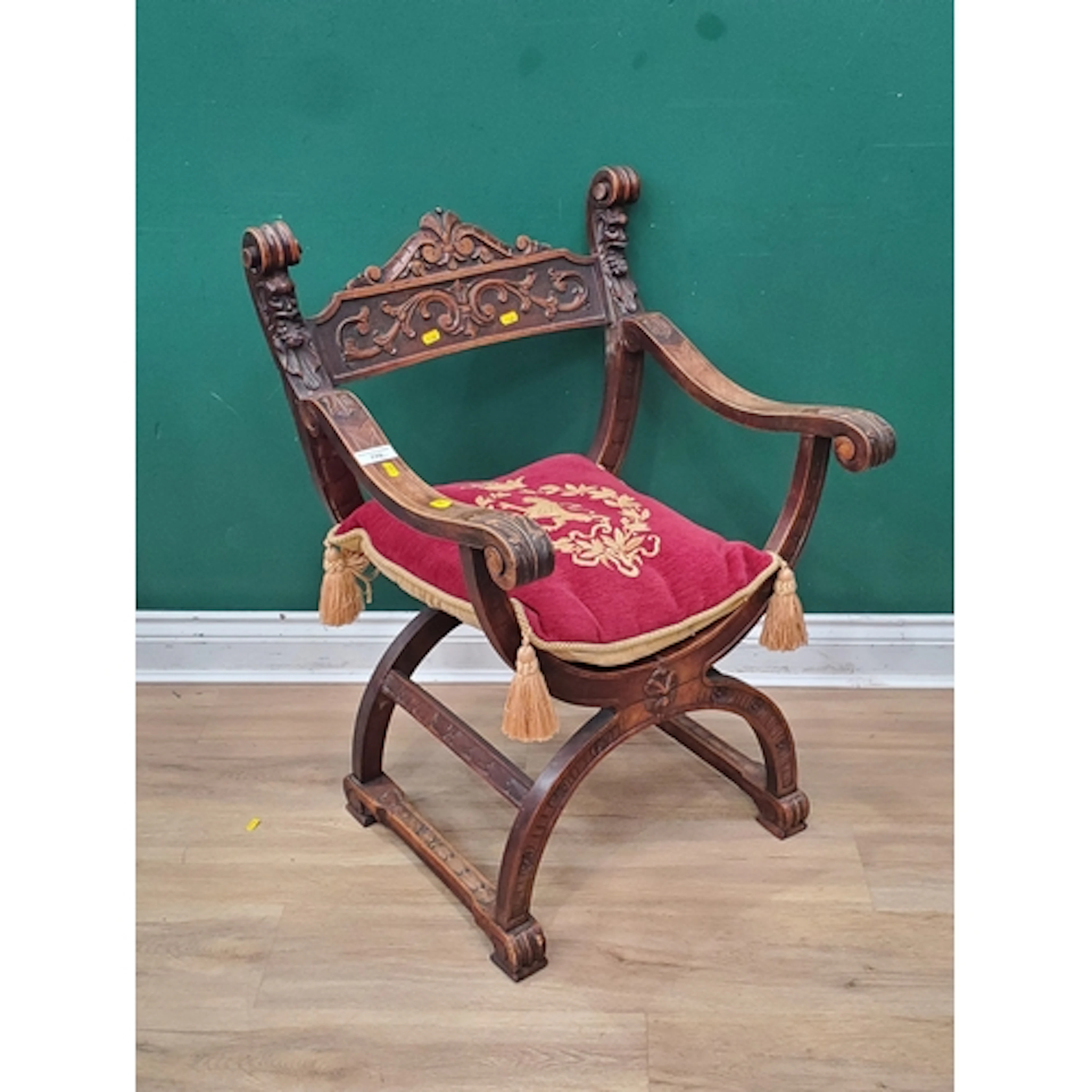 An antique Spanish carved walnut X-frame Elbow Chair 2ft 9in...