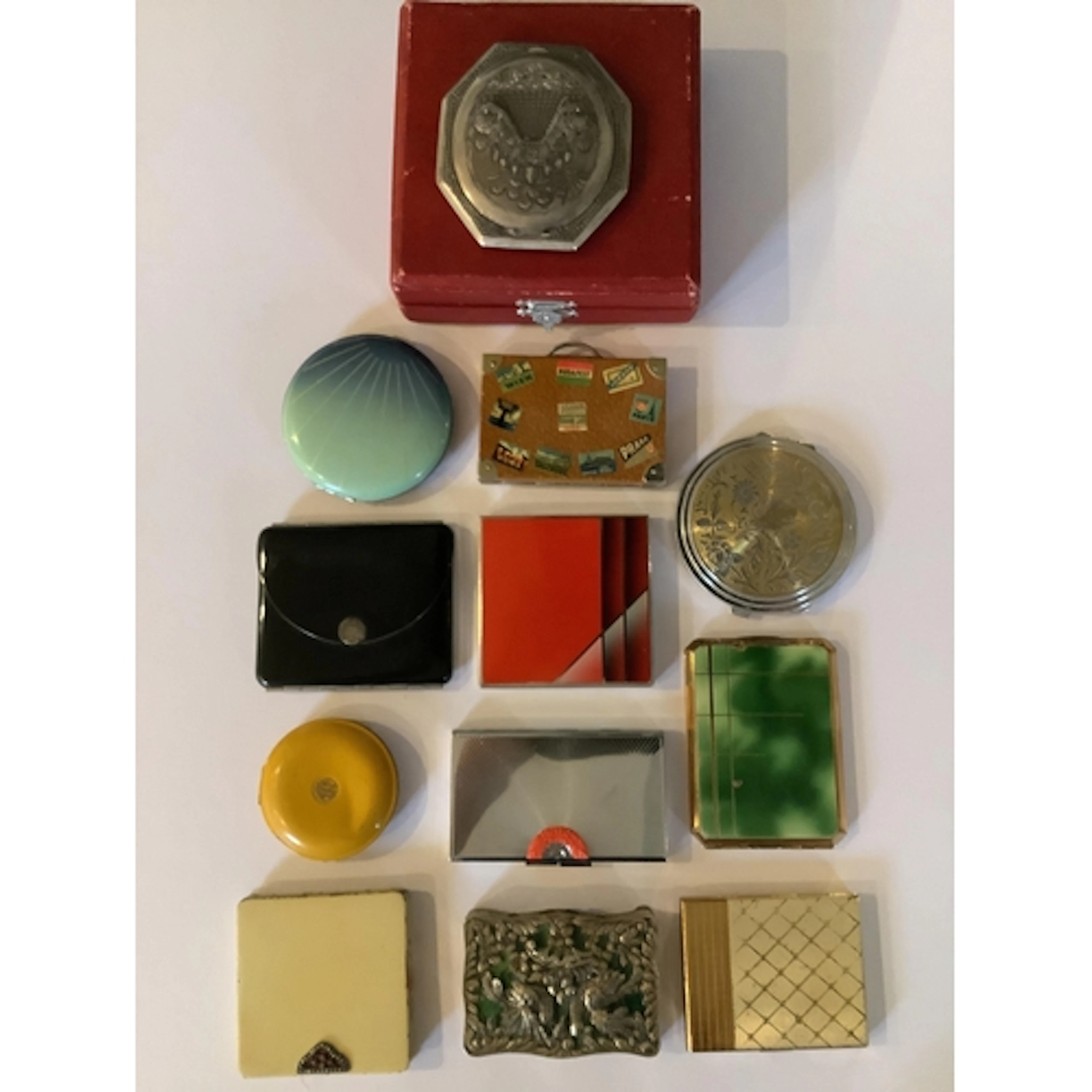 An interesting collection of twelve 1930's-50's ladies compa...