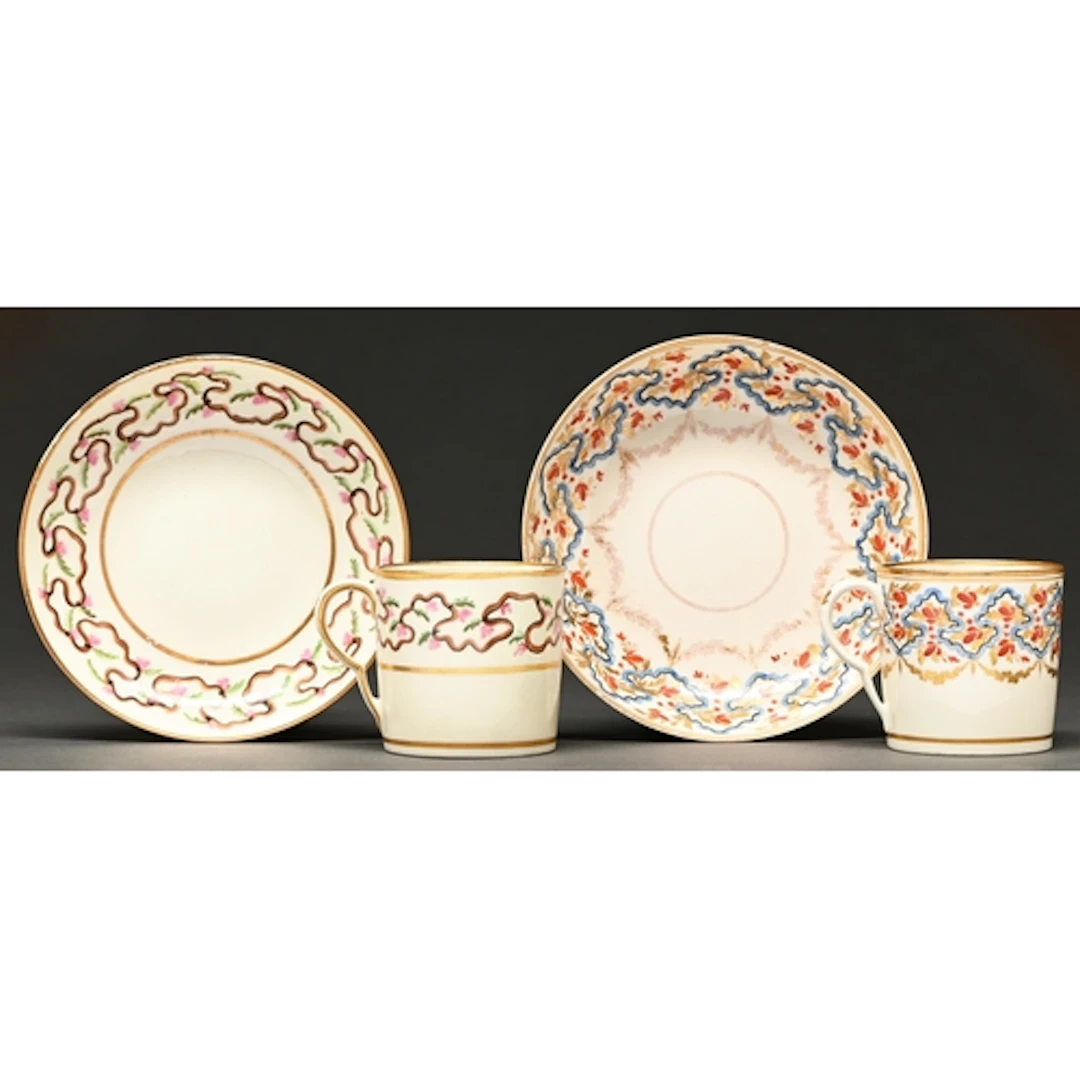 Two Pinxton coffee cans and saucers, c1800, the first painte...
