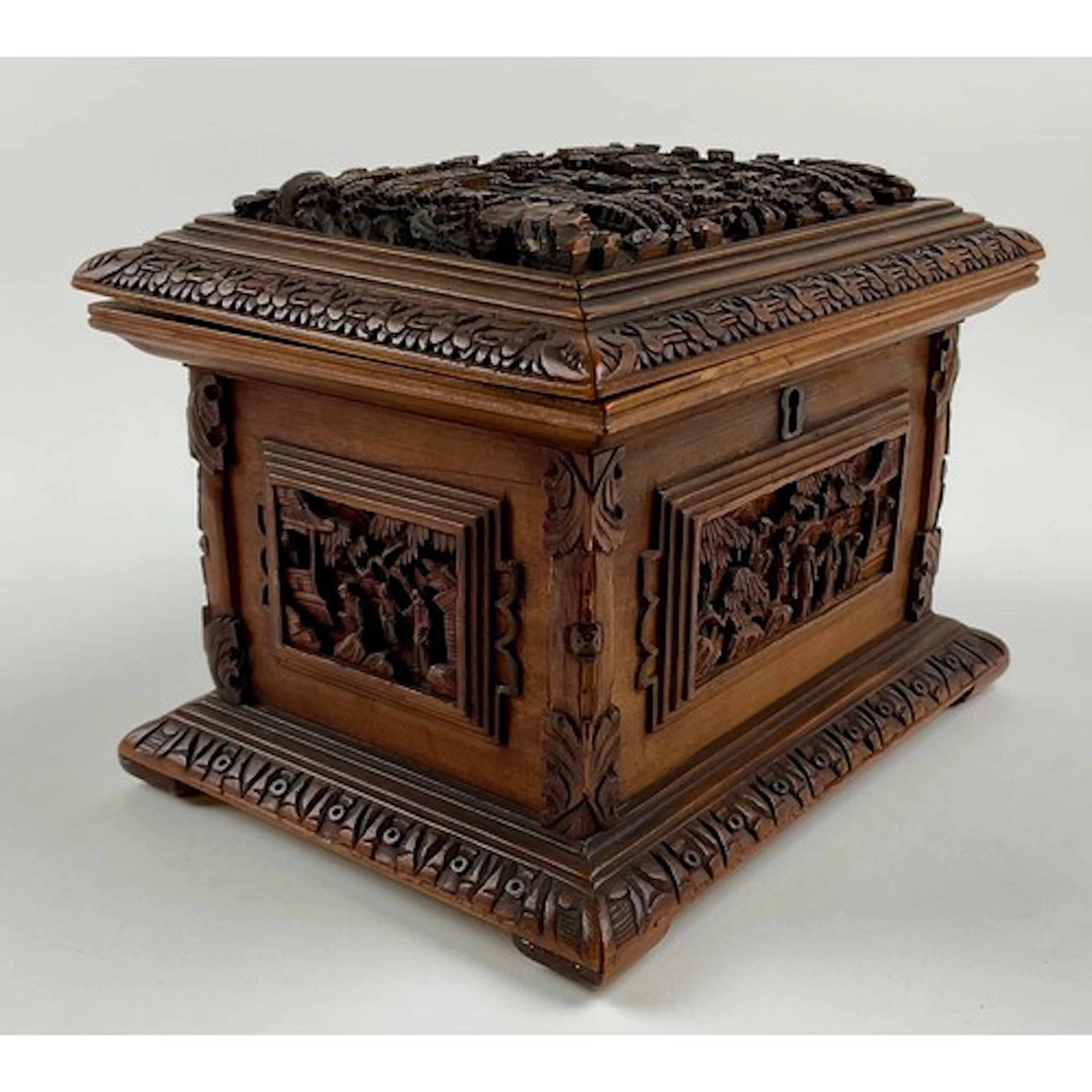 A Cantonese carved hardwood sarcophagus shaped box, the hing...