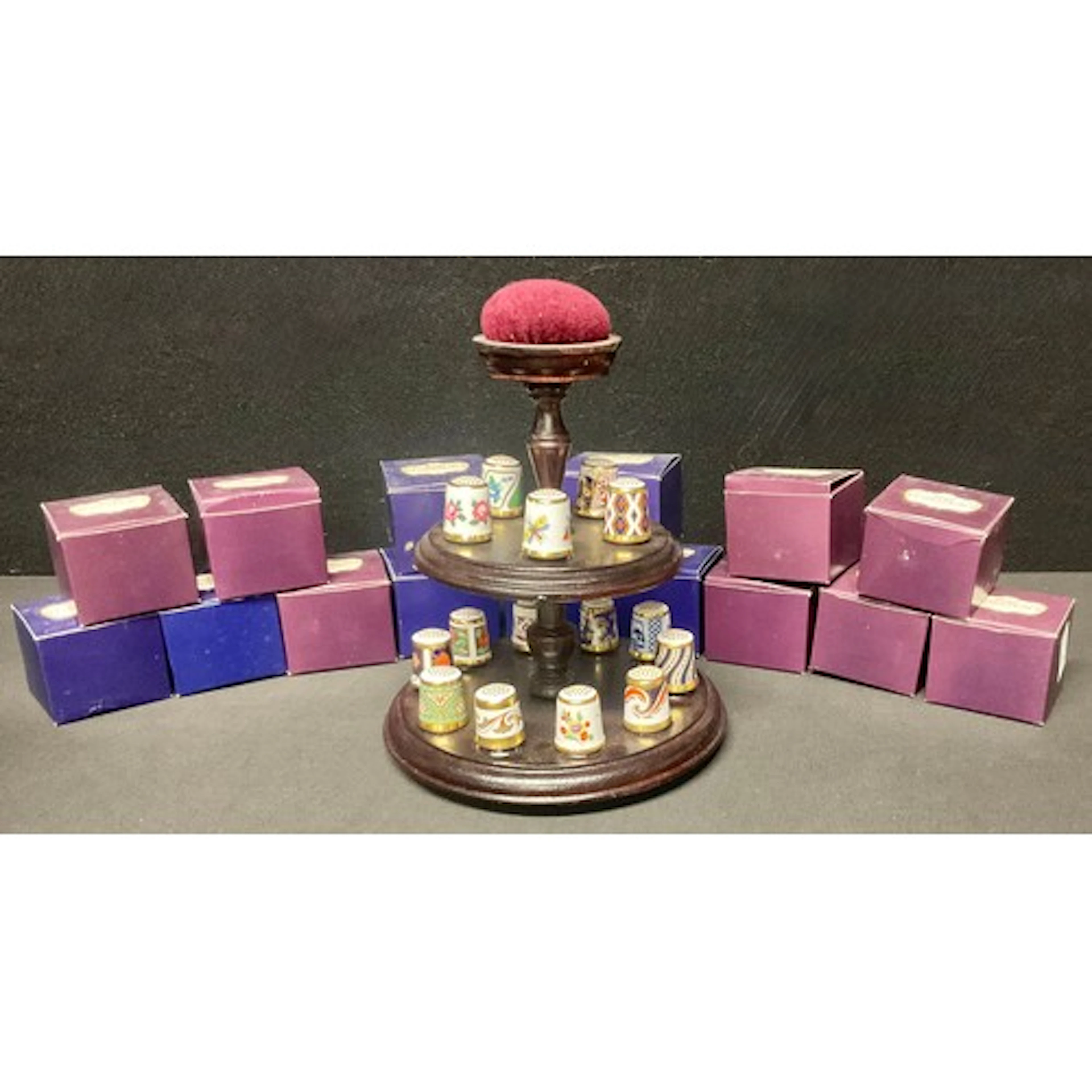 A complete collection of fifteen Royal Crown Derby thimbles ...