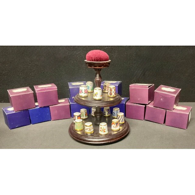 A complete collection of fifteen Royal Crown Derby thimbles ...