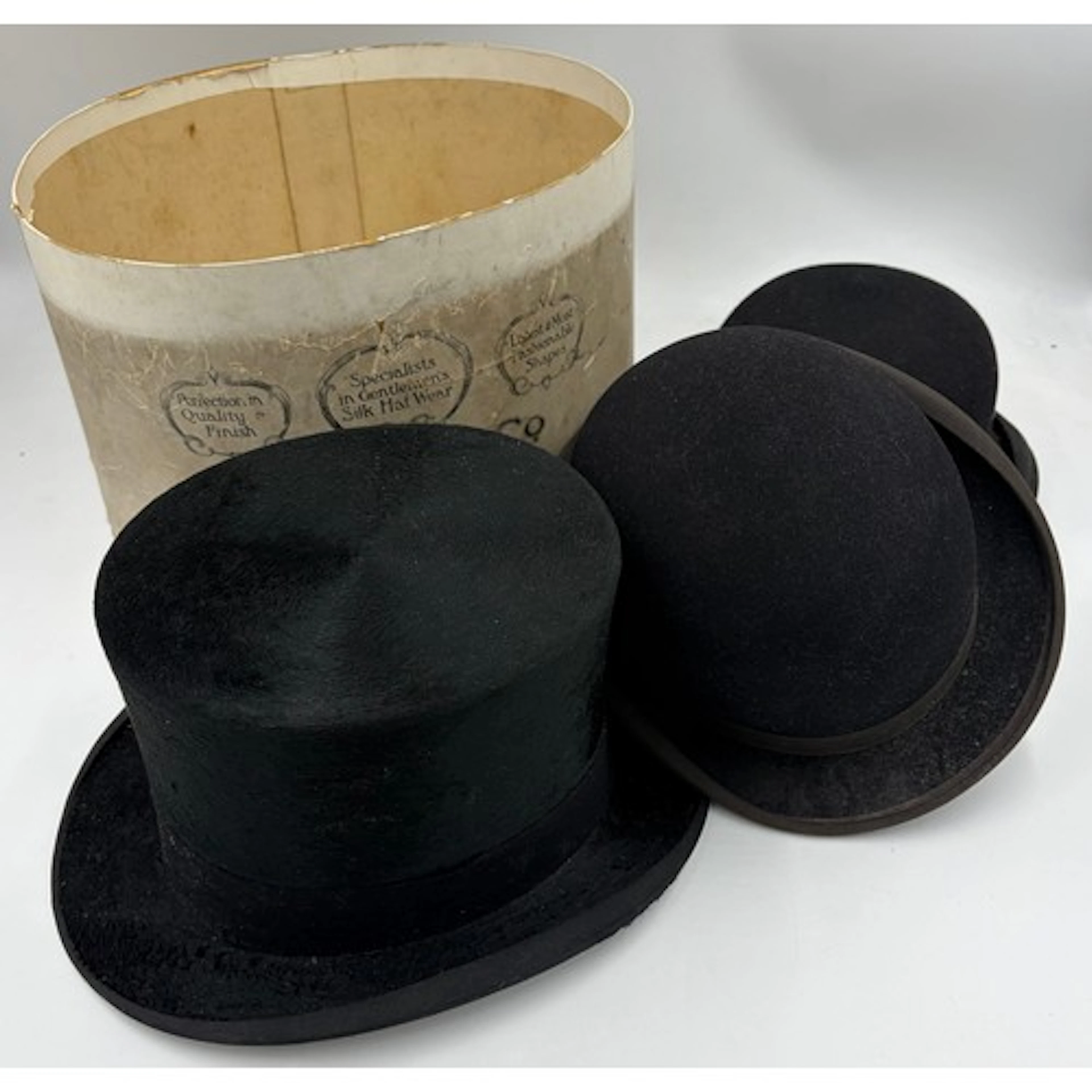 A silk top hat lined with natural tanned calf size 15, toget...