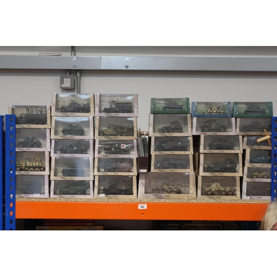 Around thirty Atlas Edition military vehicles to include tan...