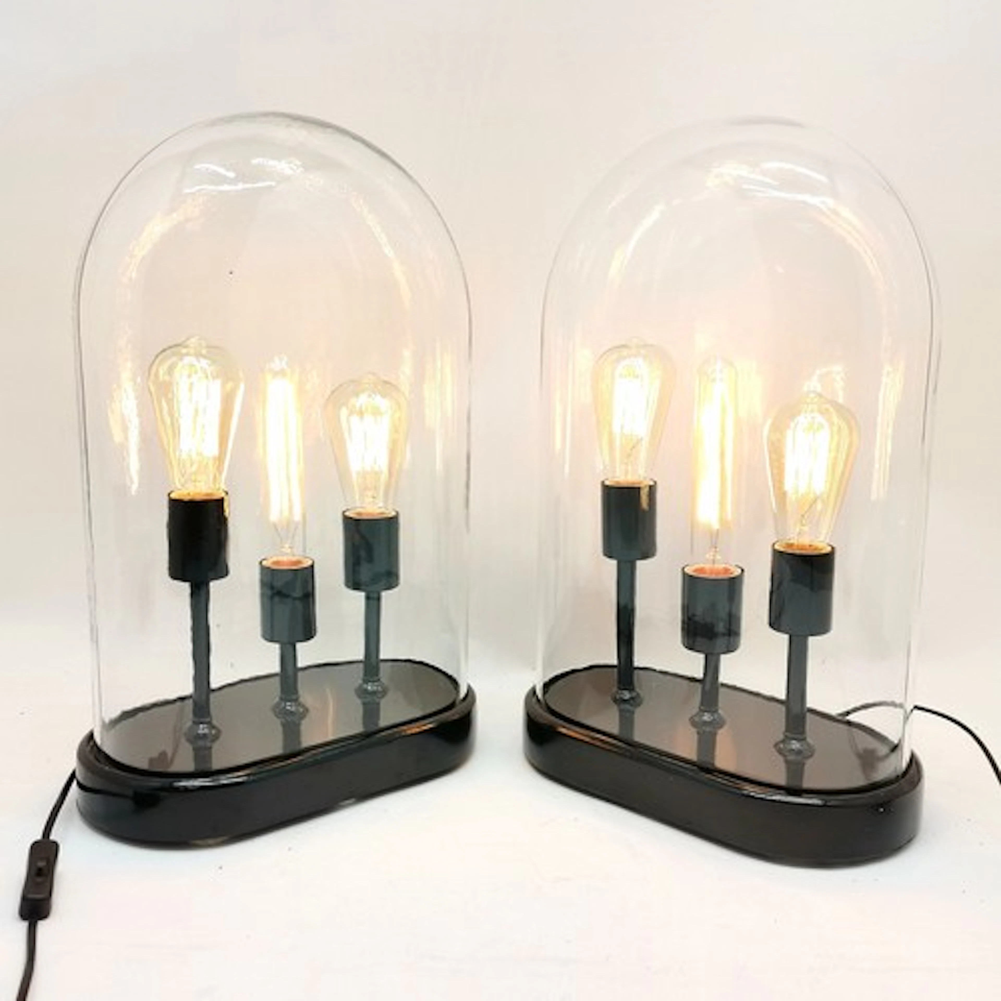Pair of contemporary steampunk triple filament lamps with gl...