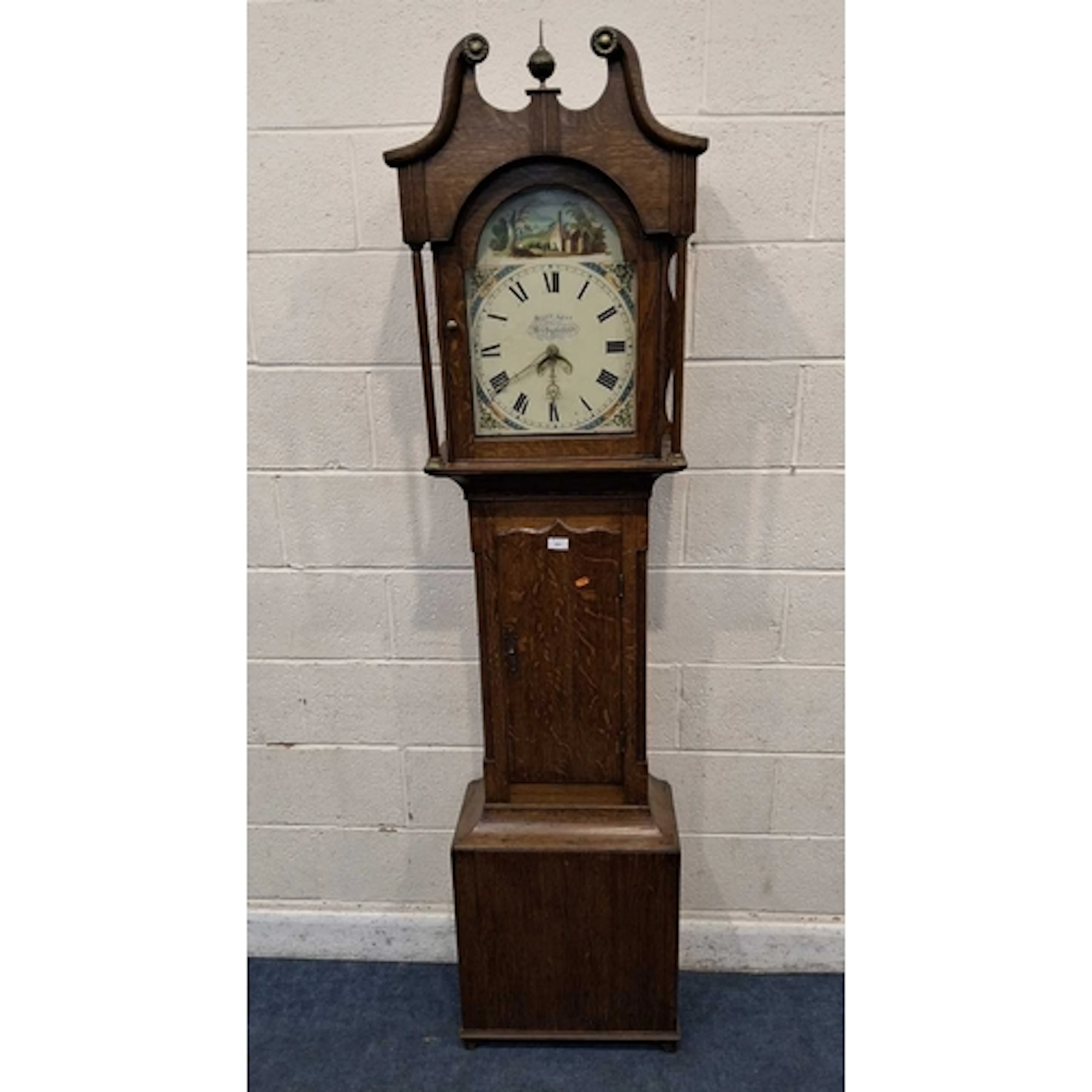 AN OAK CASED 30 HOUR LONGCASE CLOCK, with twin swan neck ped...