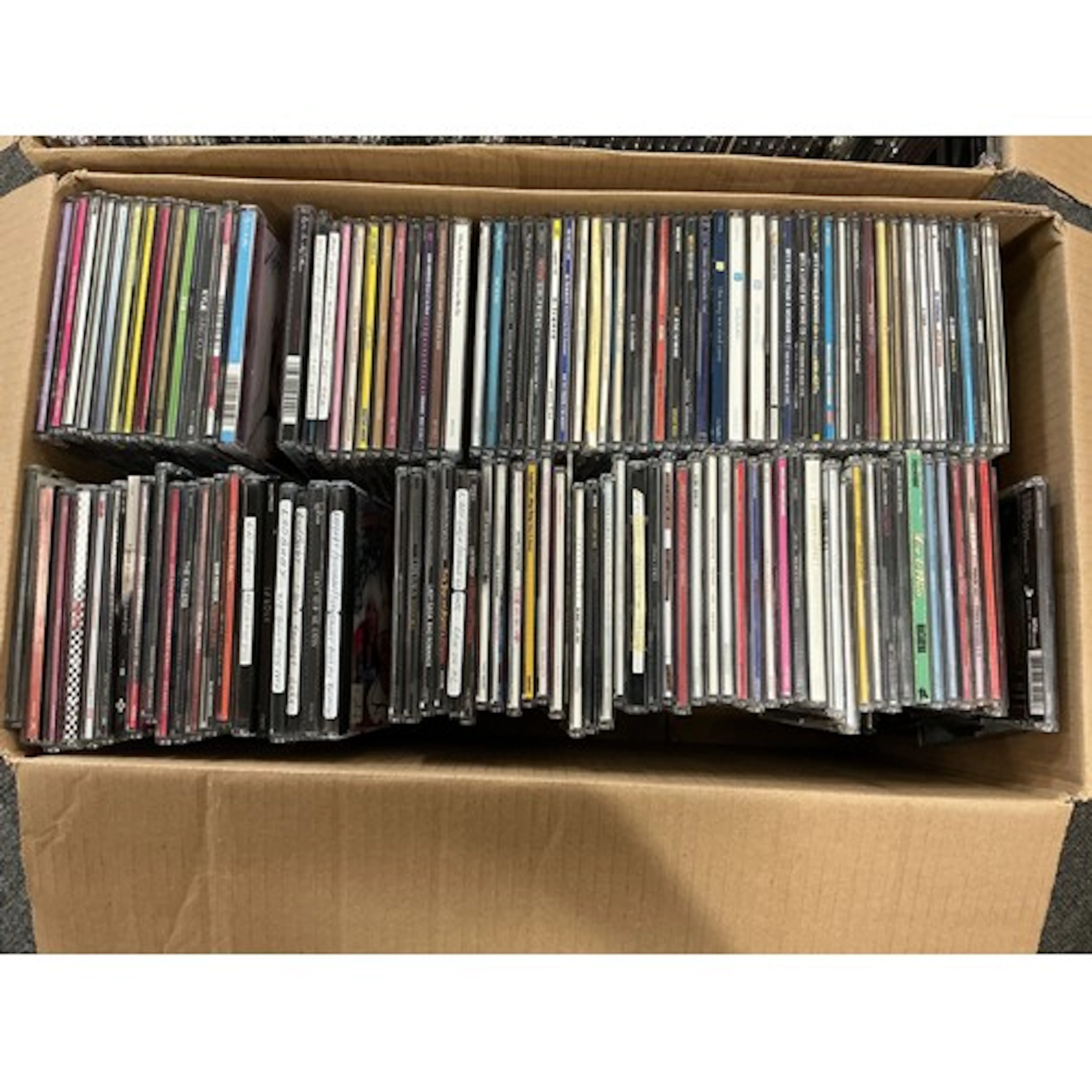 Two boxes of CD singles by various artists including Oasis, ...