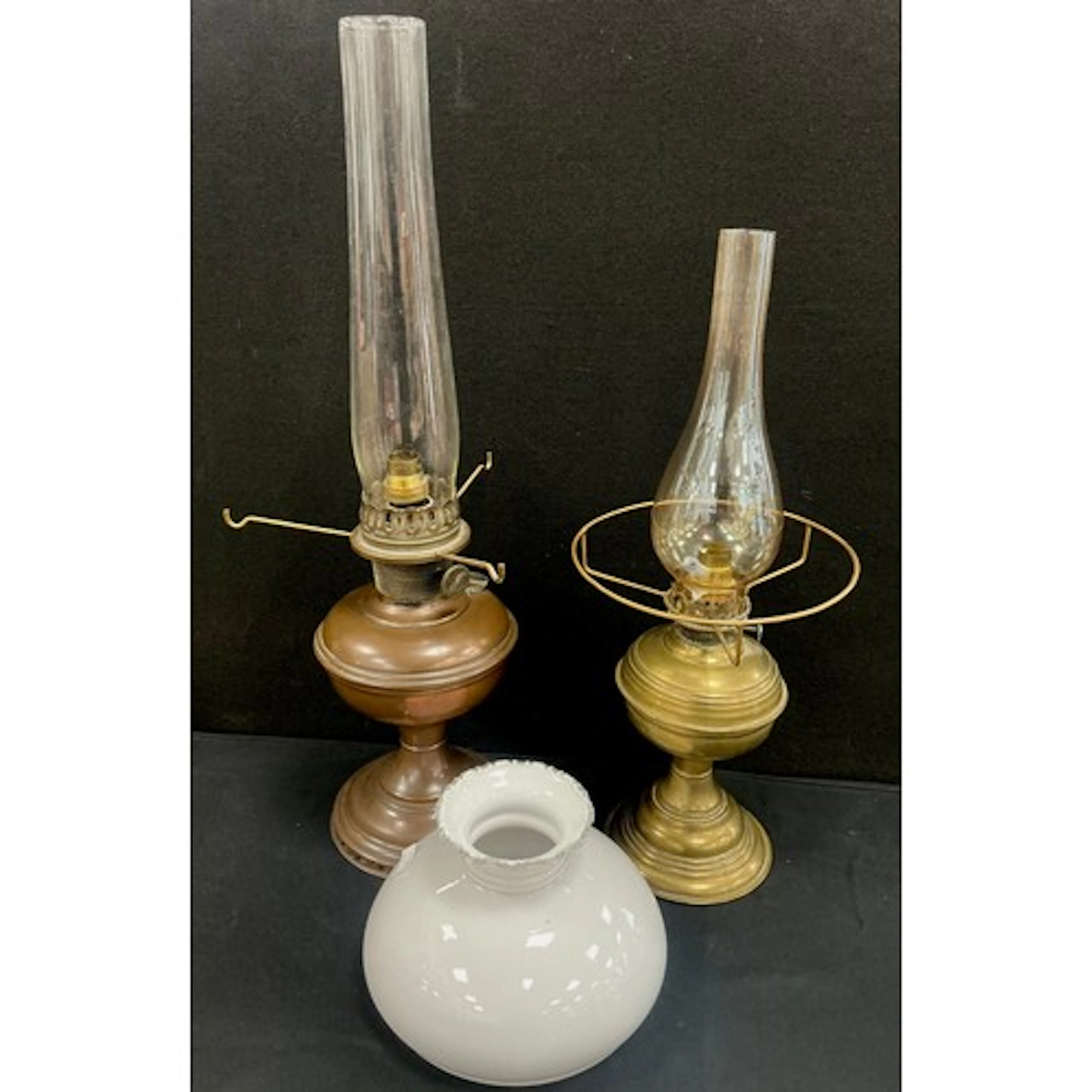 A copper paraffin lamp with glass flue, 60cm height, another...