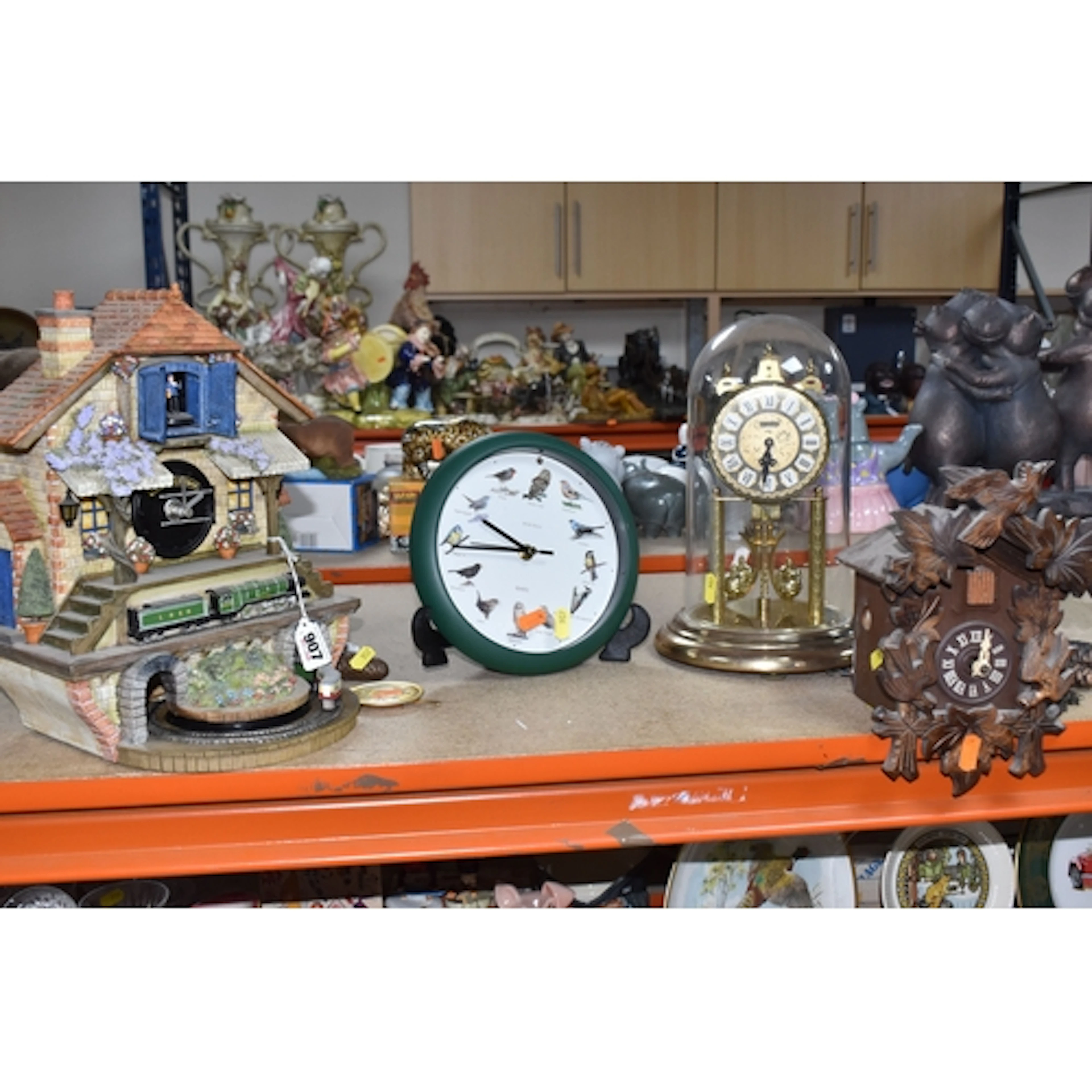 A GROUP OF FOUR VINTAGE CLOCKS, to include Black Forest styl...