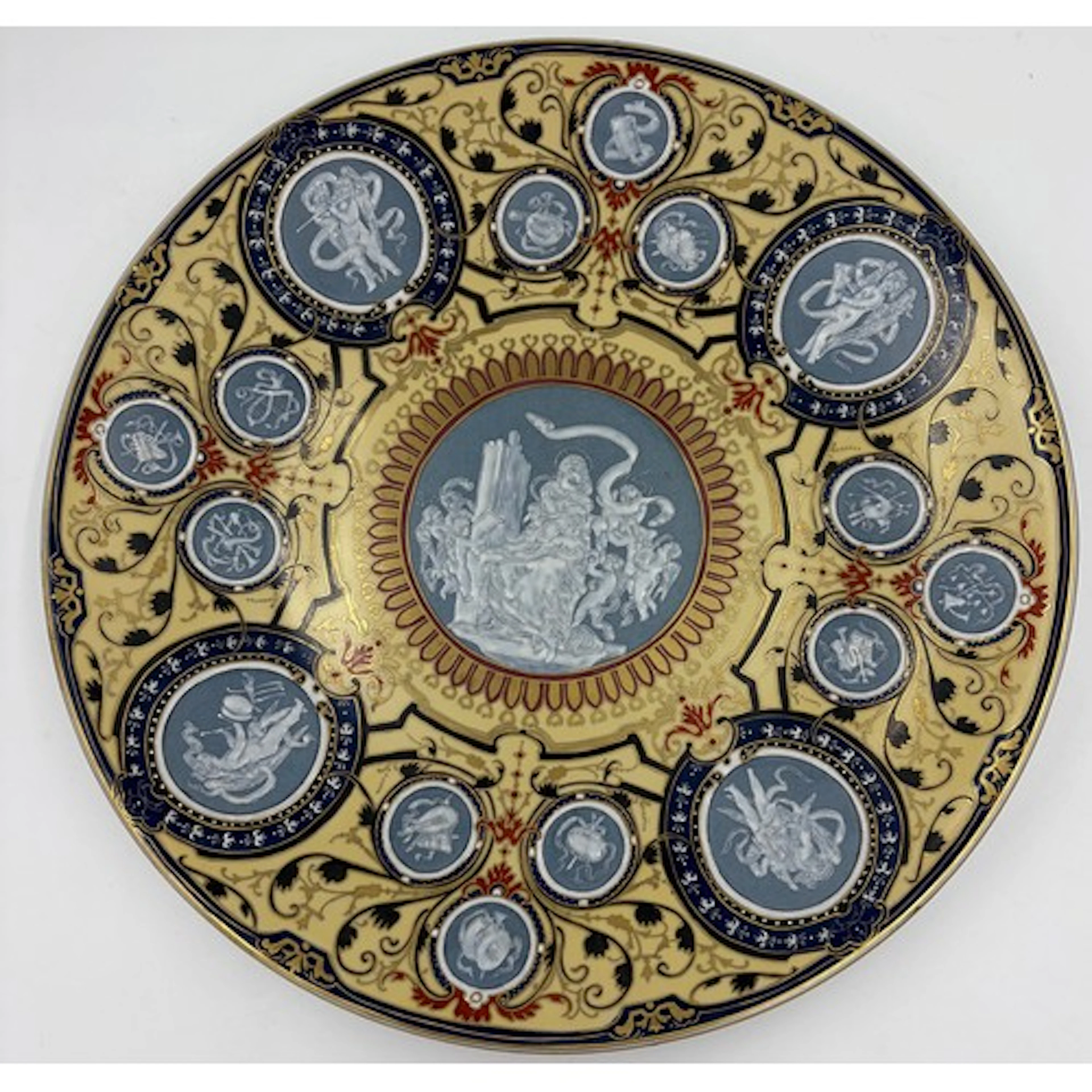 A 19thC porcelain charger with pâte sur pâte style classical...