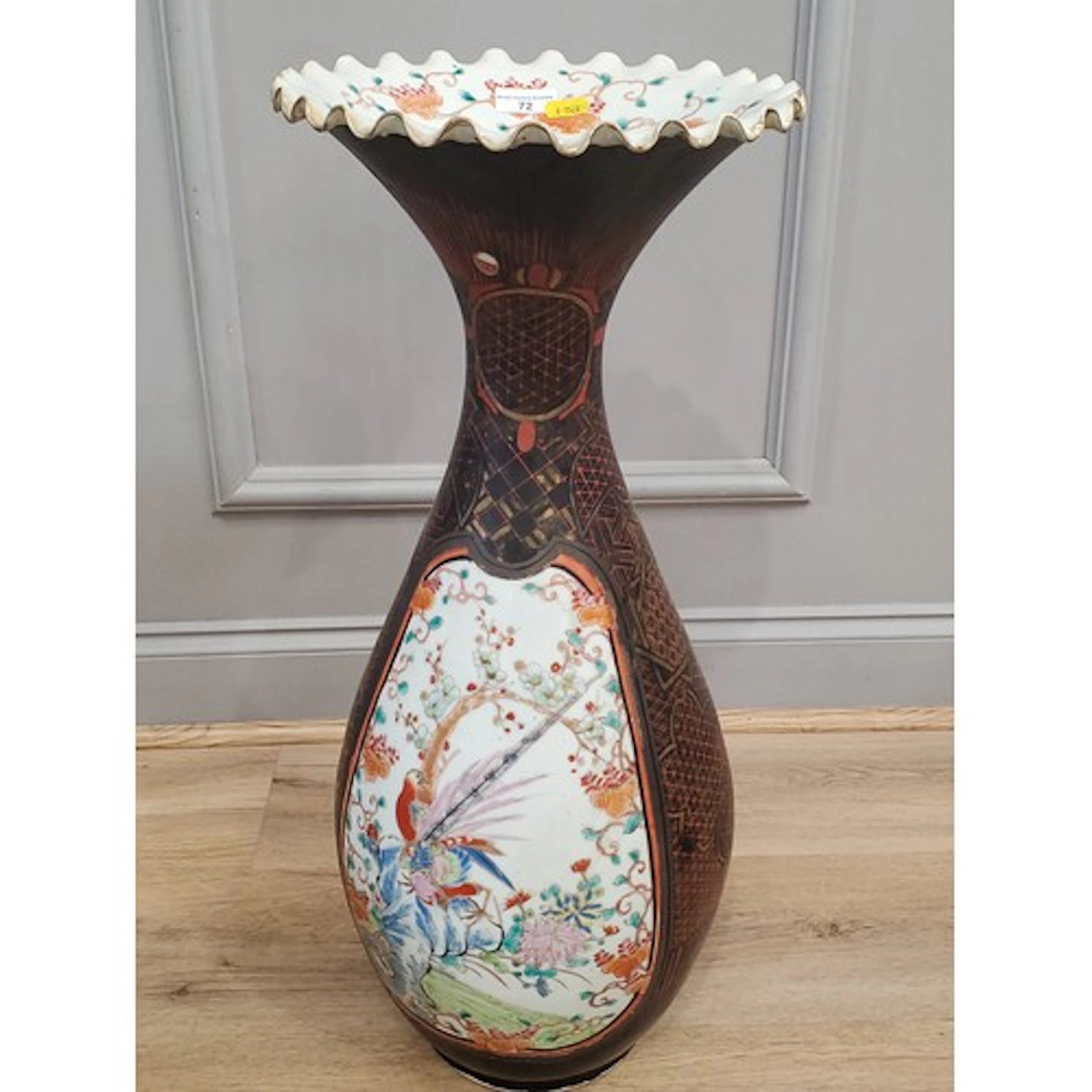 An Oriental ceramic baluster Vase with flared rim and slende...