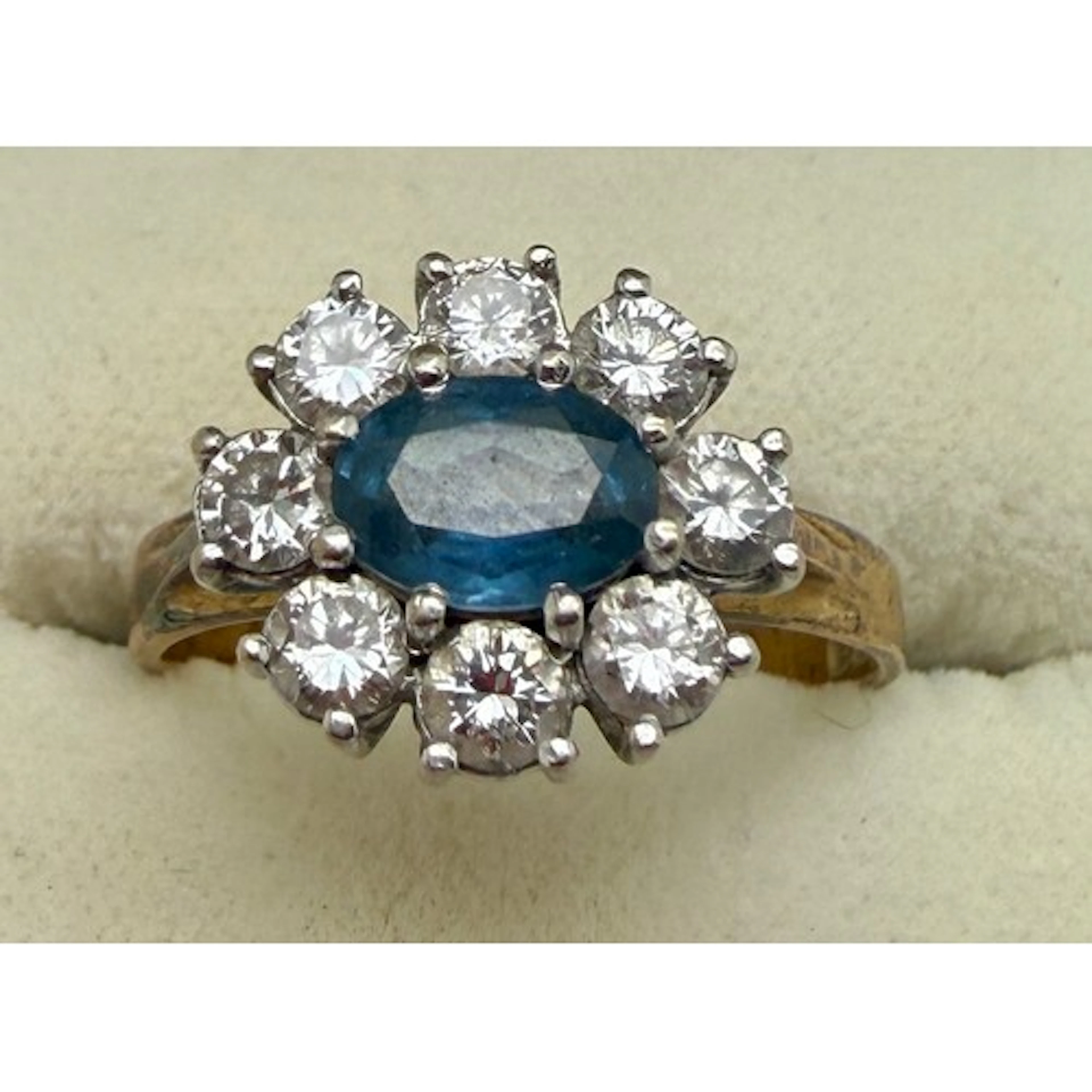 A diamond and blue stone cluster ring set in 18 carat yellow...