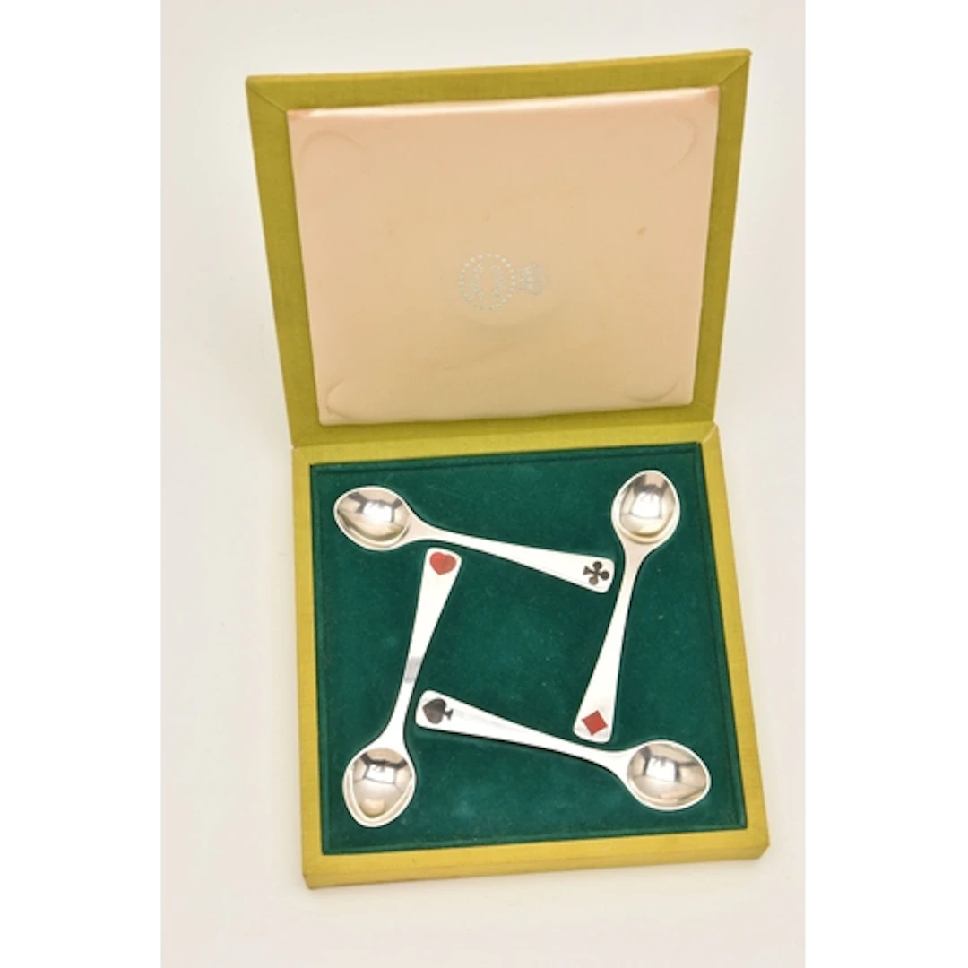 A CASED SET OF PLAYING CARDS ENAMEL 'GEORG JENSEN' COFFEE SP...