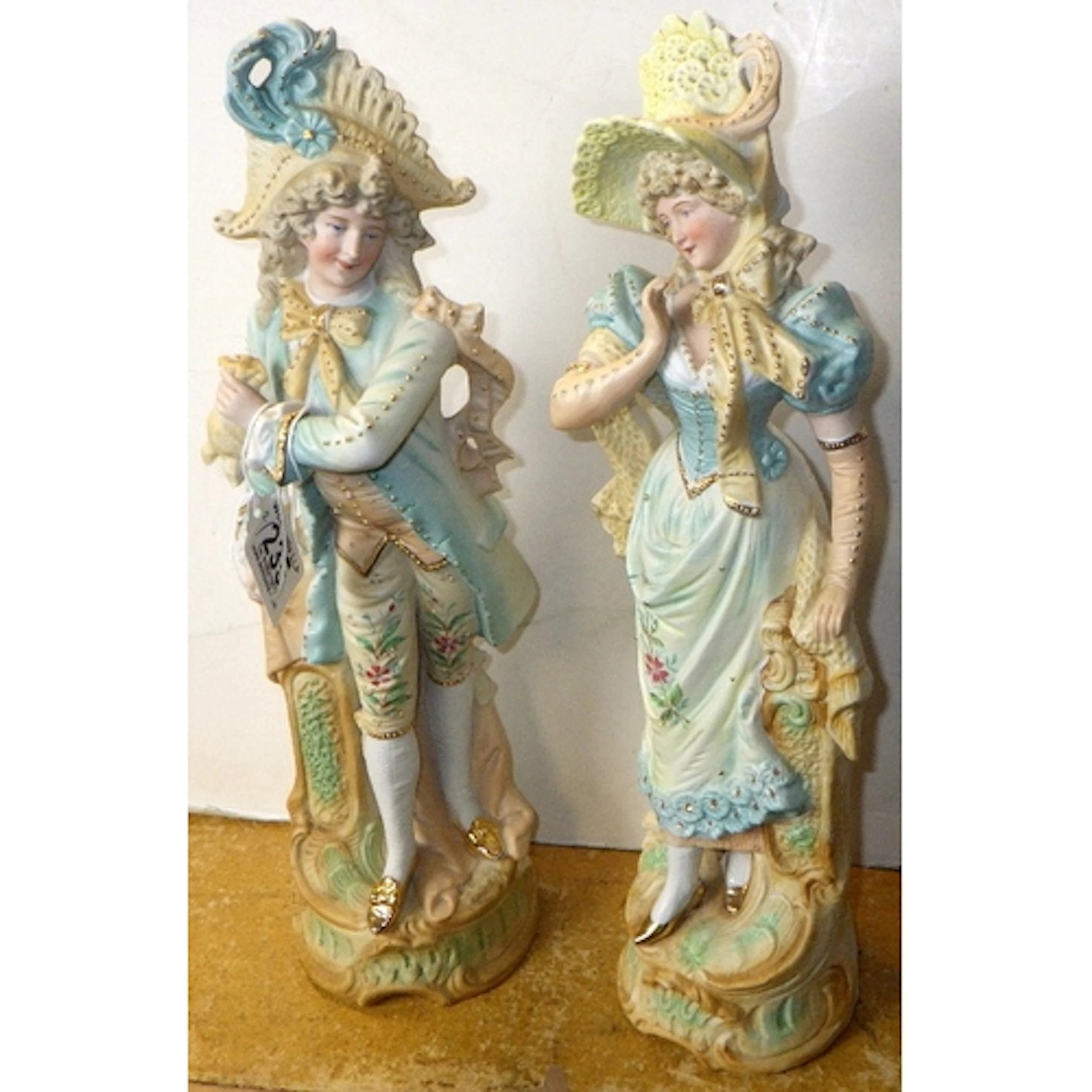 A pair of continental bisque figures