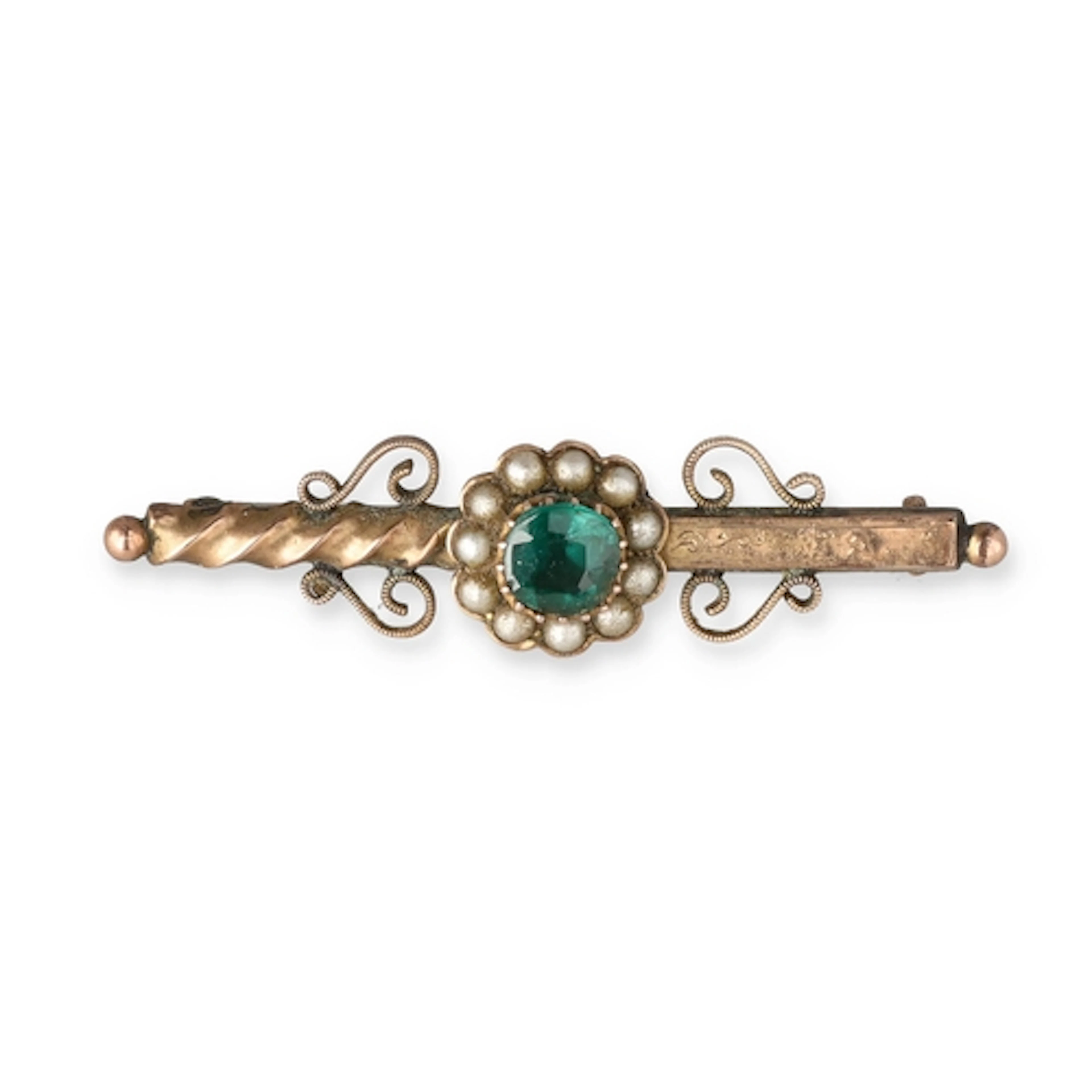 A 9CT GOLD AND EMERALD FLOWER HEAD BAR BROOCH The emerald su...