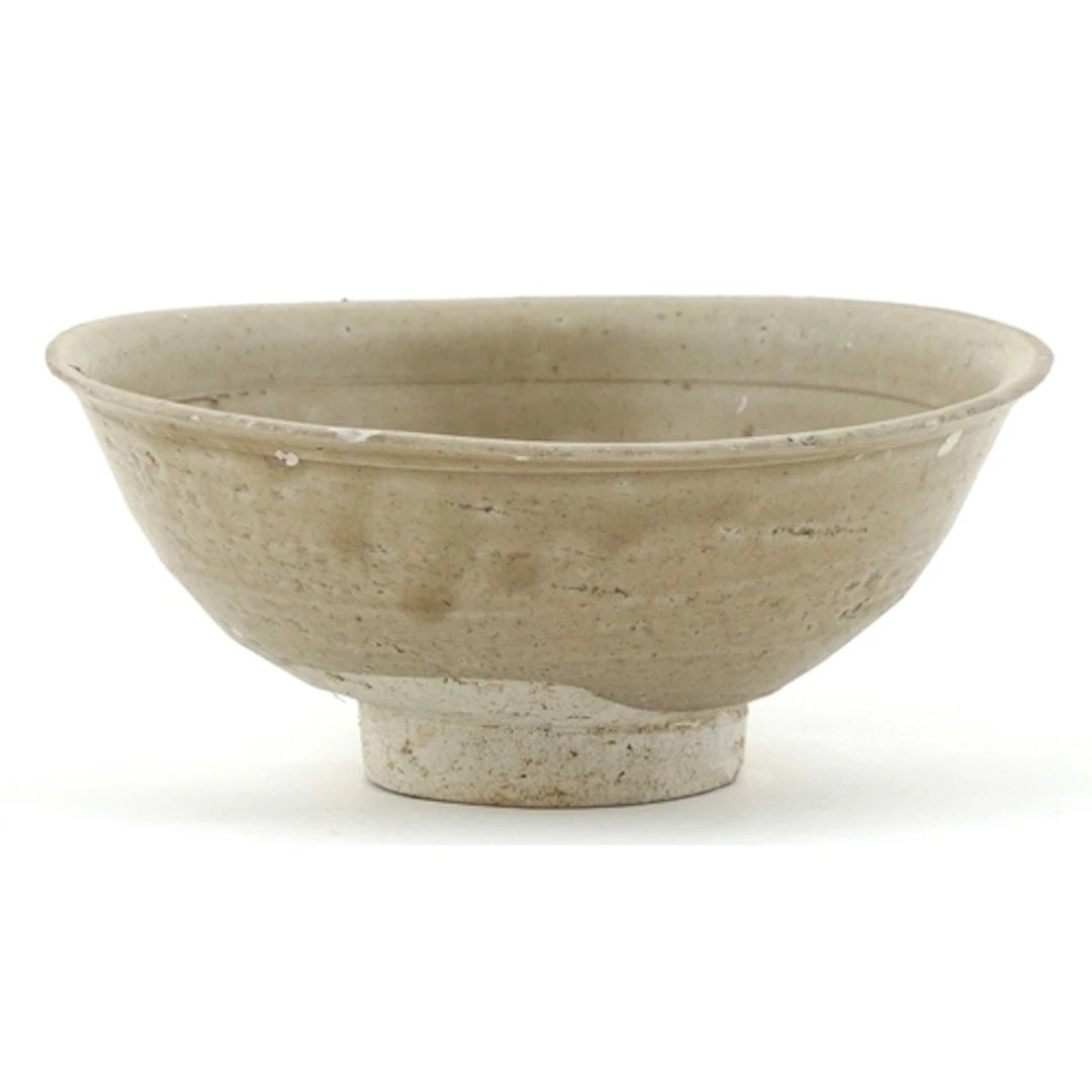 Antique Chinese stoneware footed bowl with grey-green celado...