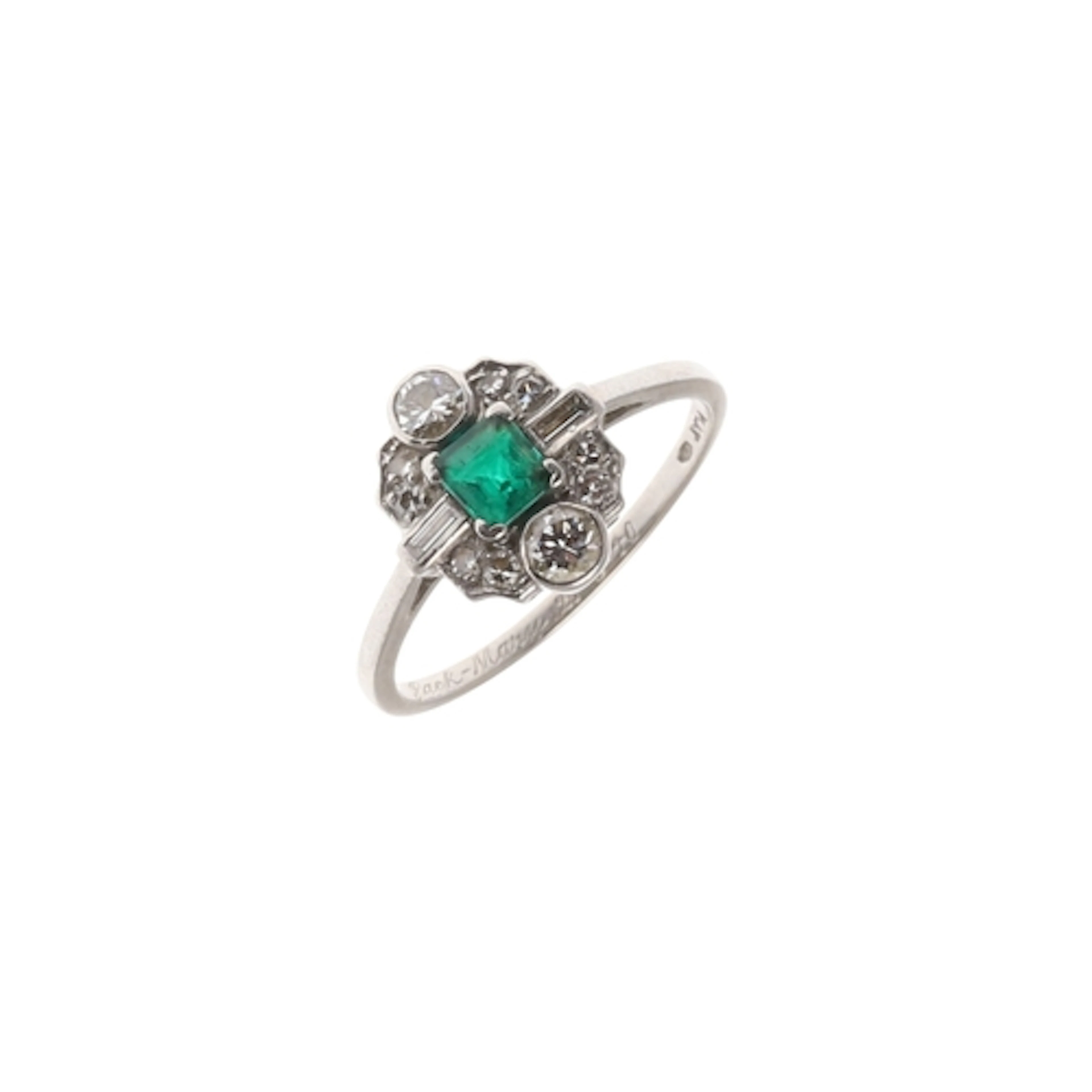 AN EMERALD AND DIAMOND CLUSTER RING. the slightly rectangula...