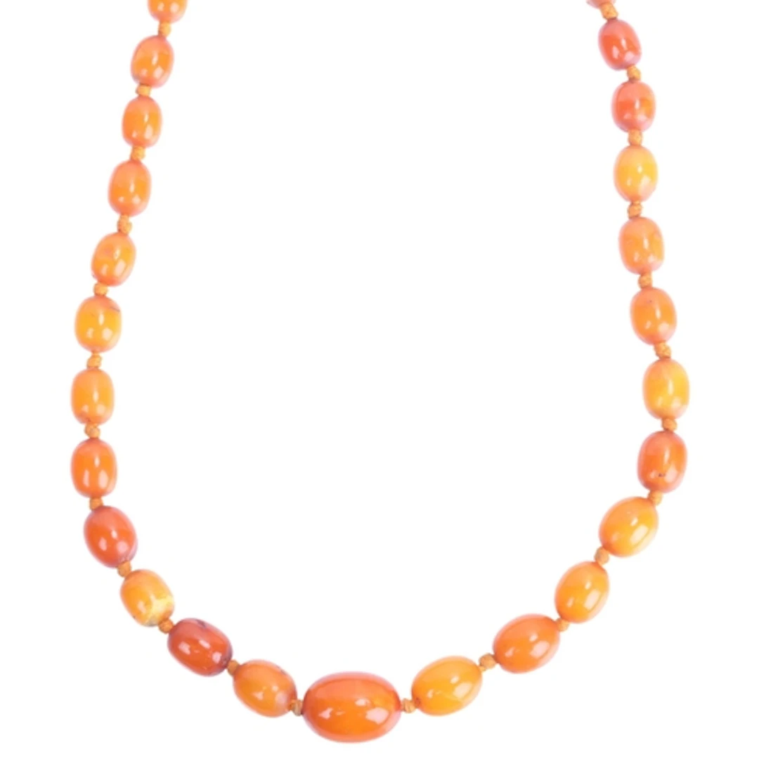 A single-row butterscotch amber bead necklace, beads measure...