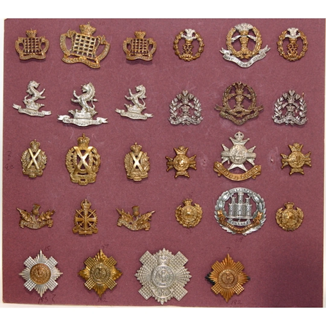 A good carded selection of military cap badges, various eras...