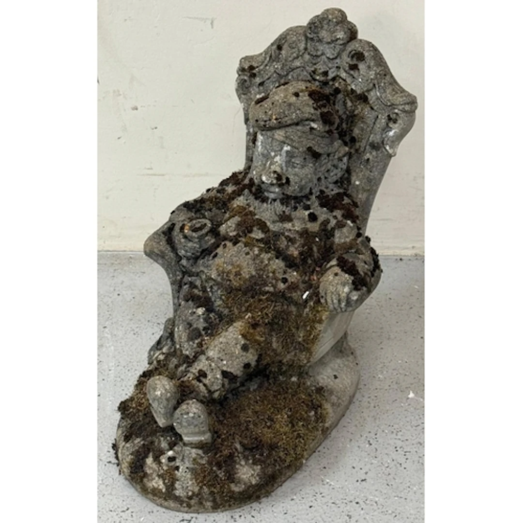 A concrete garden statue of a well refreshed gentleman in a ...