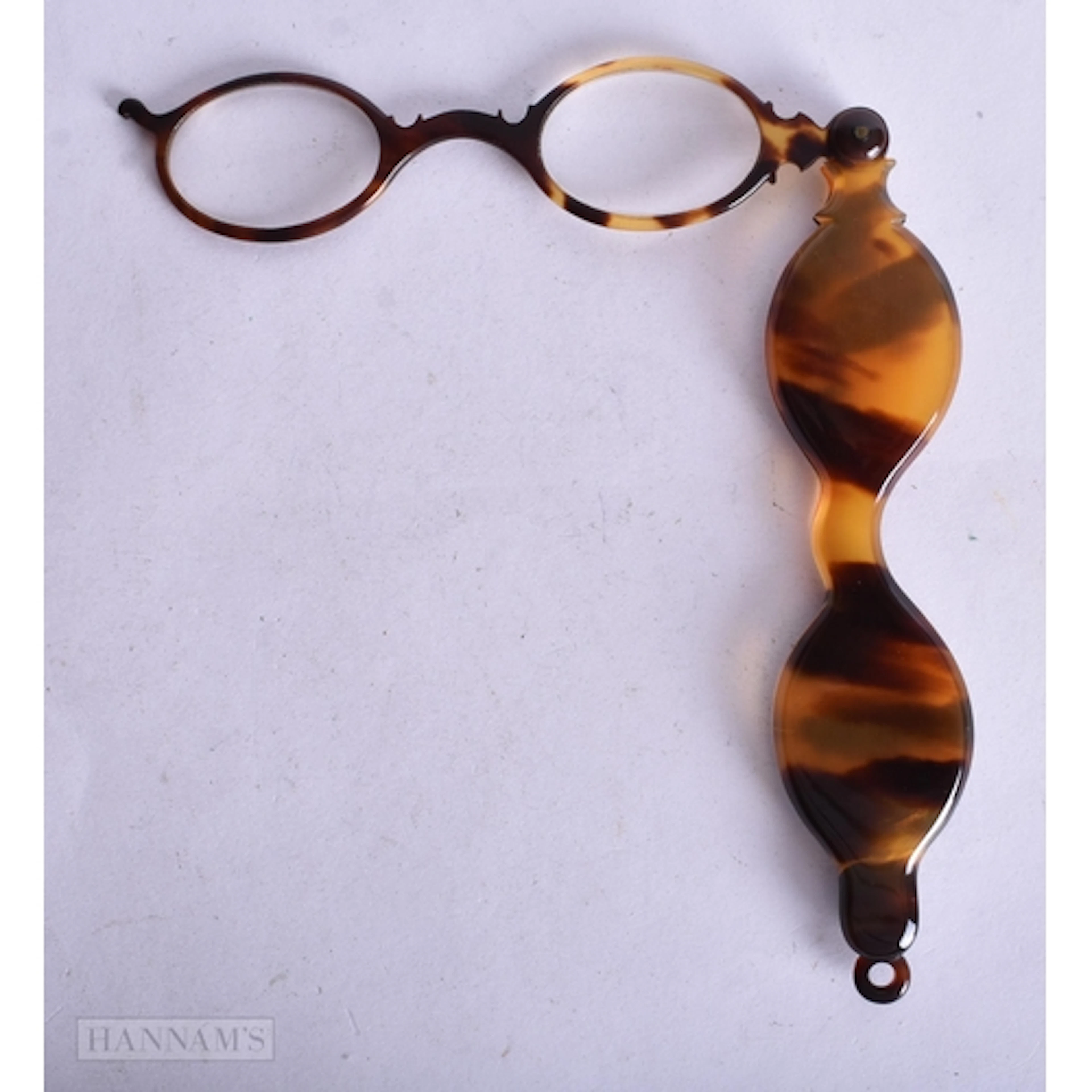 A LARGE PAIR OF TORTOISESHELL LORGNETTES. 24 cm long.