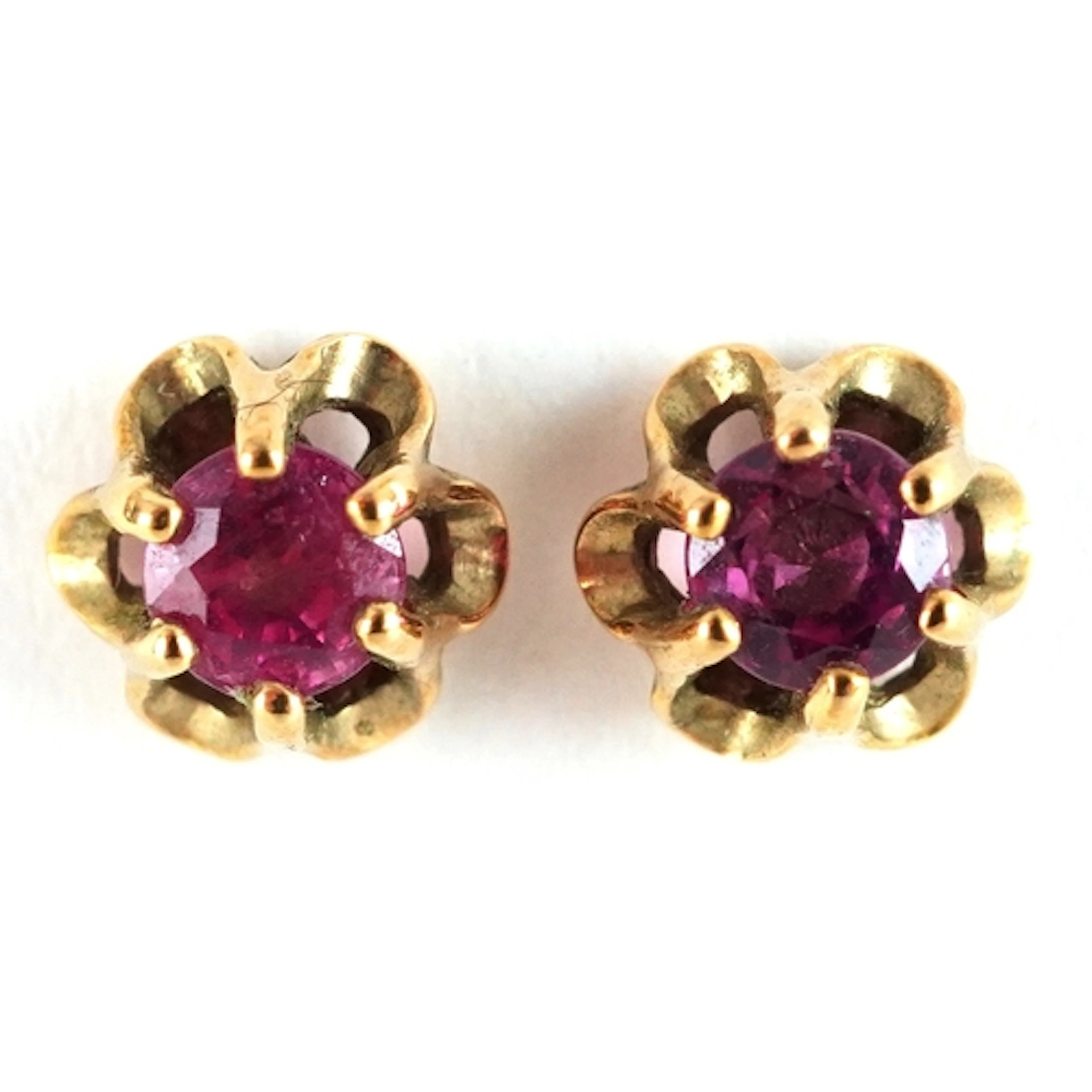 Pair of 9ct gold pink stone stud earrings, 5.8mm in diameter...