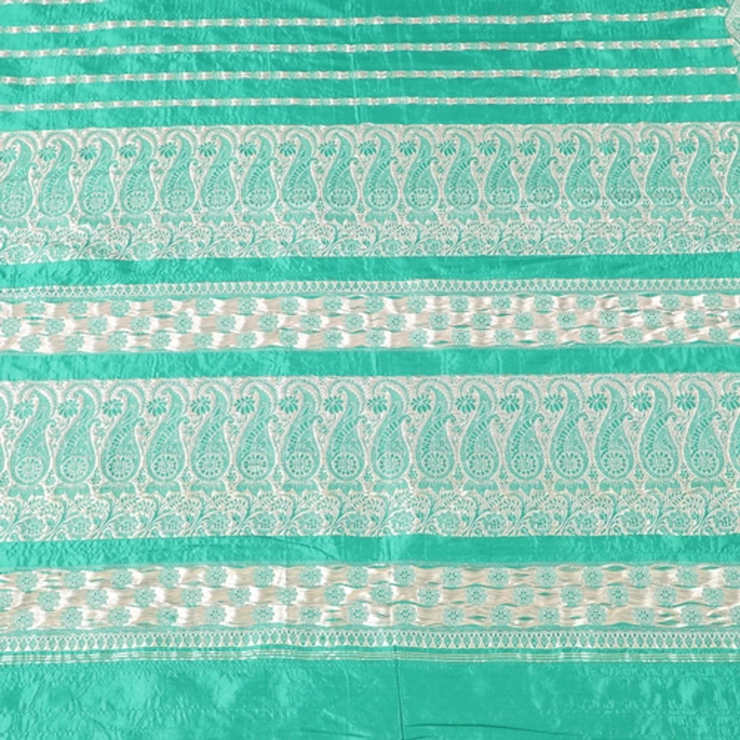 A LENGTH OF EMERALD GREEN SARI SILK. Late 19th - early 20th ...
