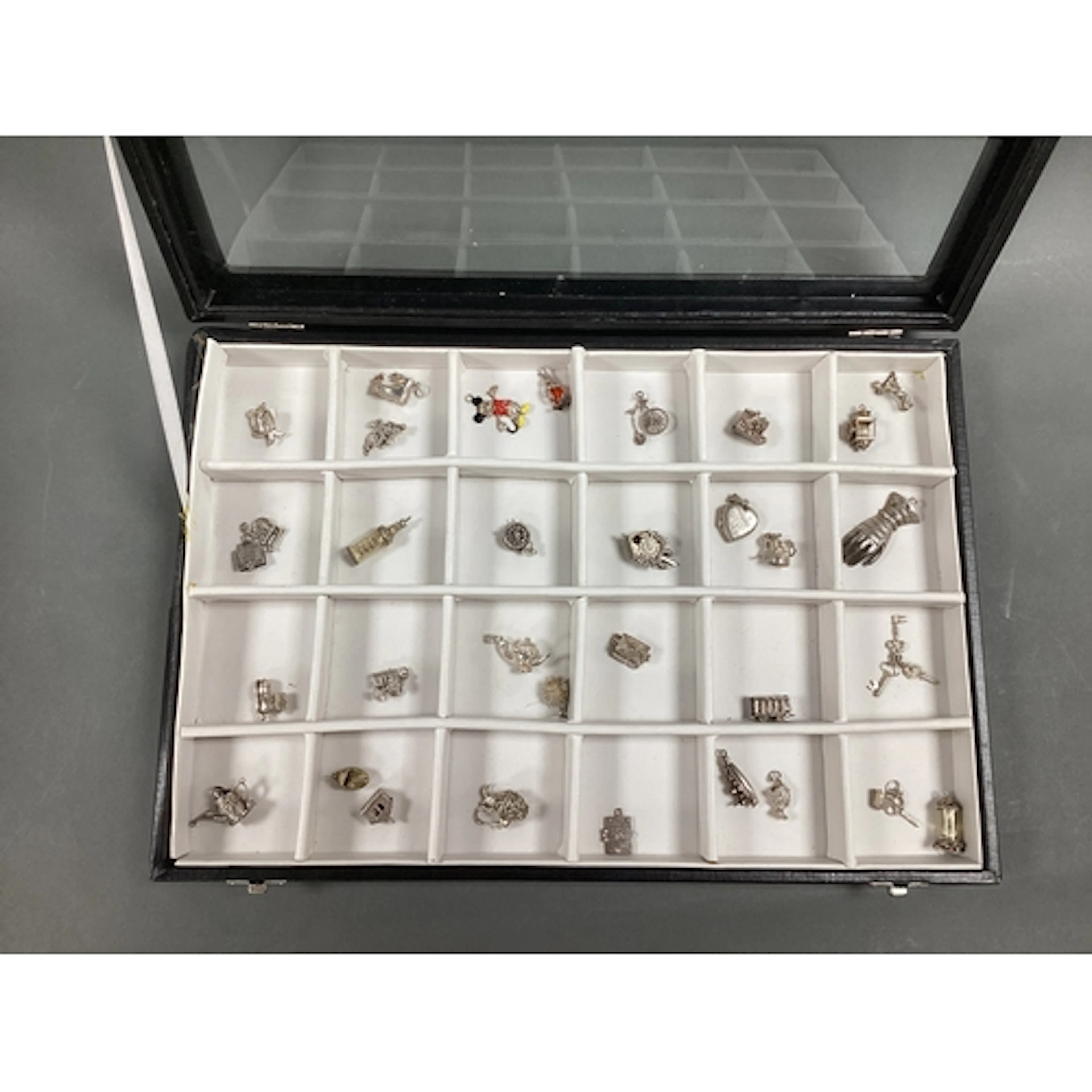 A Collection of Assorted Novelty Charm Pendants, including c...
