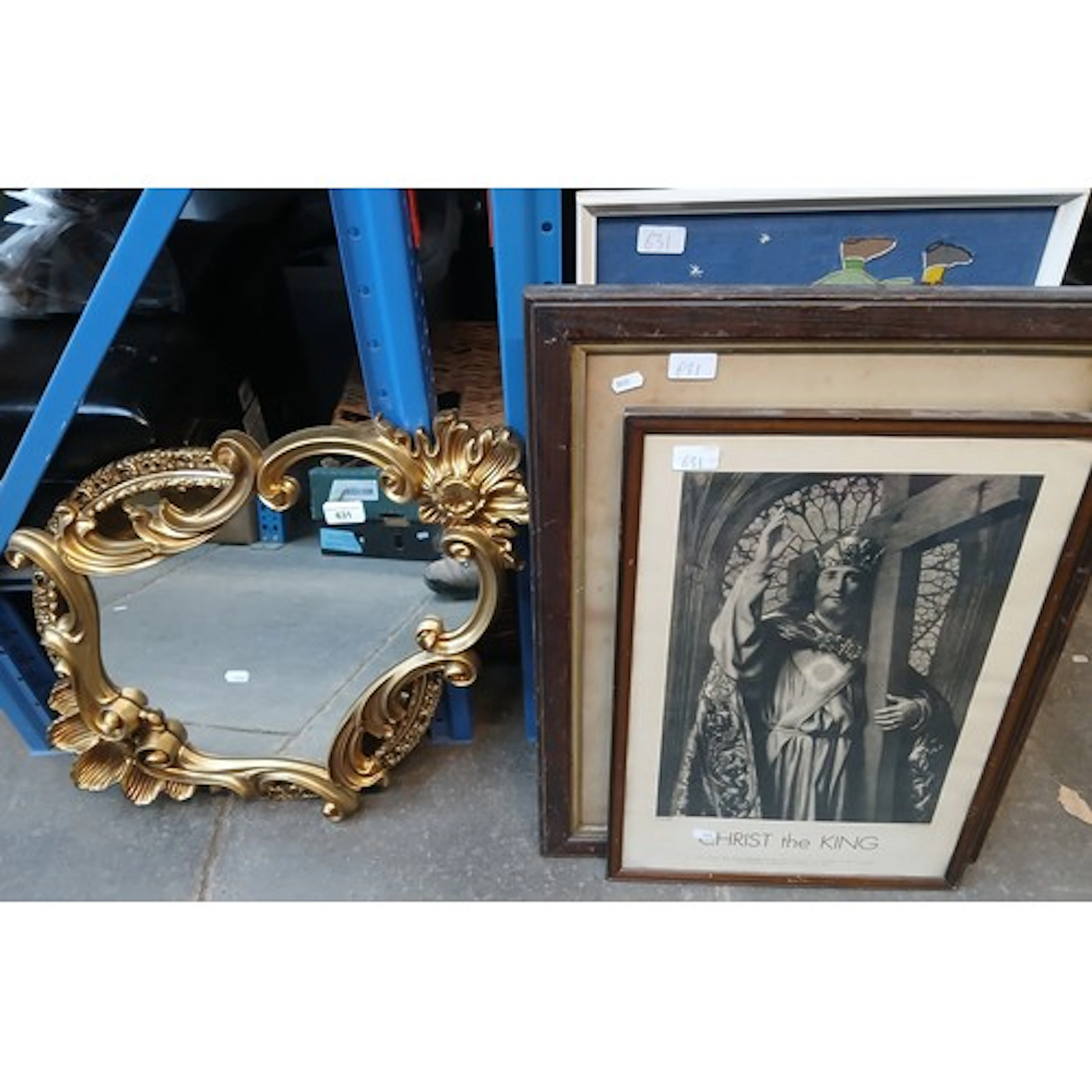 Assorted mirrors and religious prints.