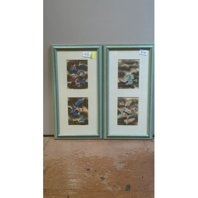 A pair of framed Chinese-style dragon prints, each mounted w...