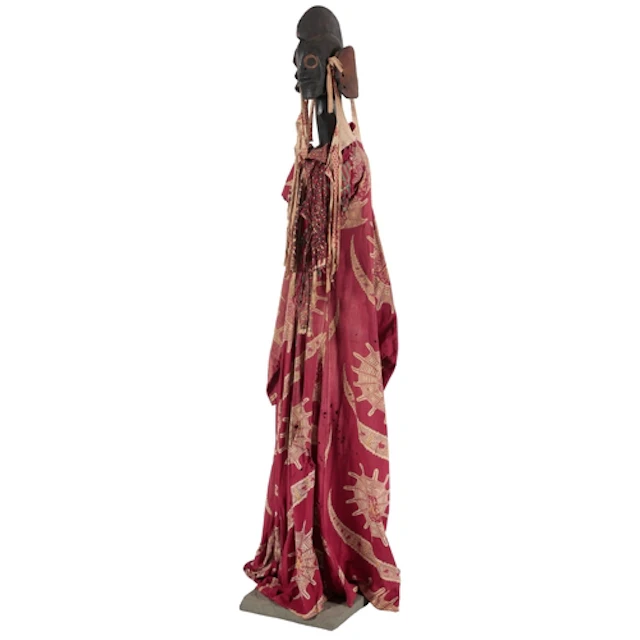 A tall Mumuye standing wood figure, Nigeria, with a crested ...