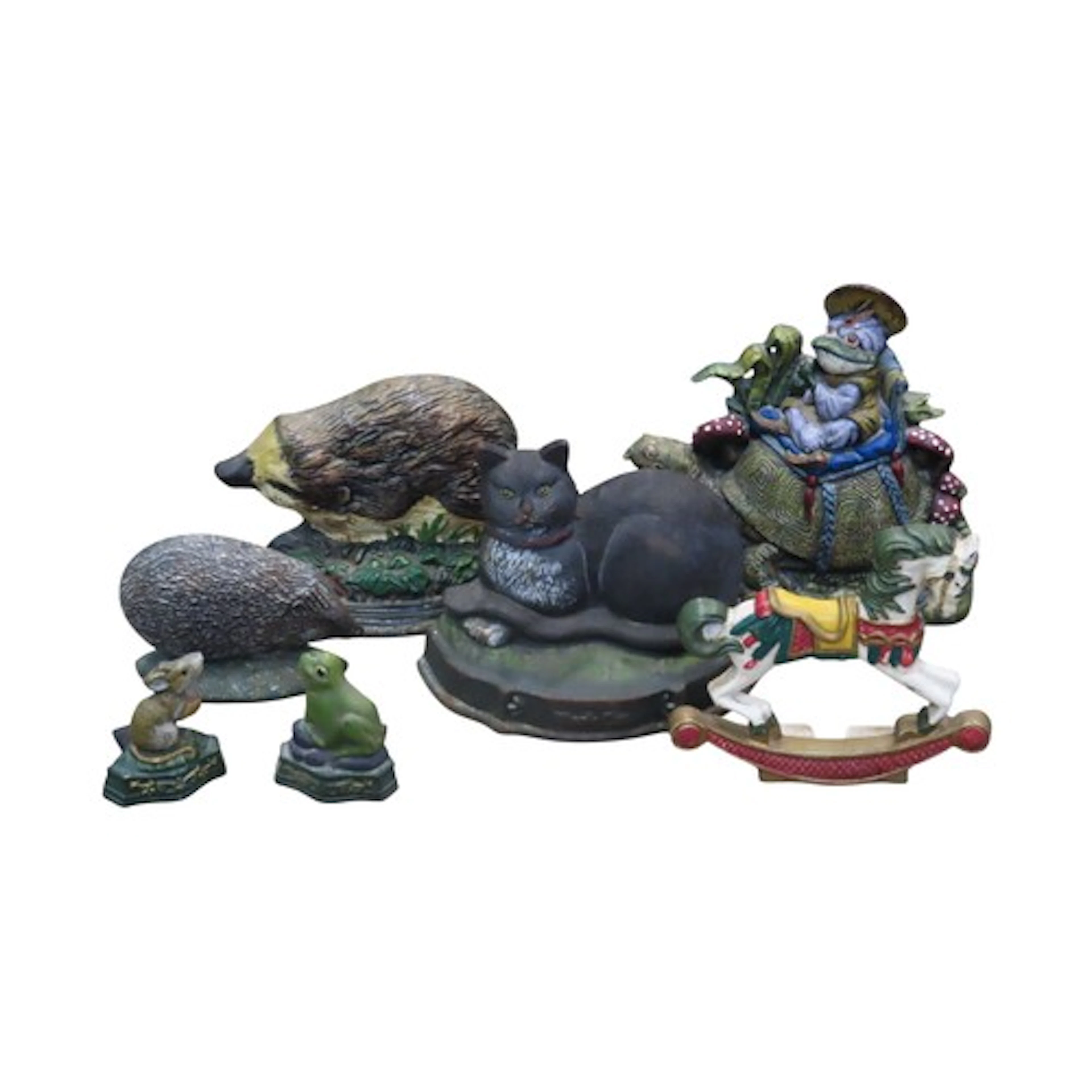 Seven painted novelty cast iron door stops/porters in the fo...