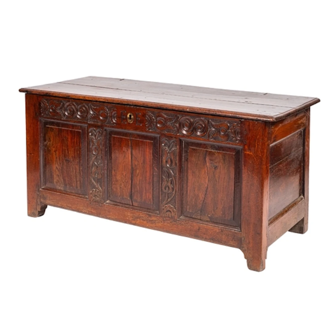 An oak coffer, late 17th /early 18th century; the cover with...