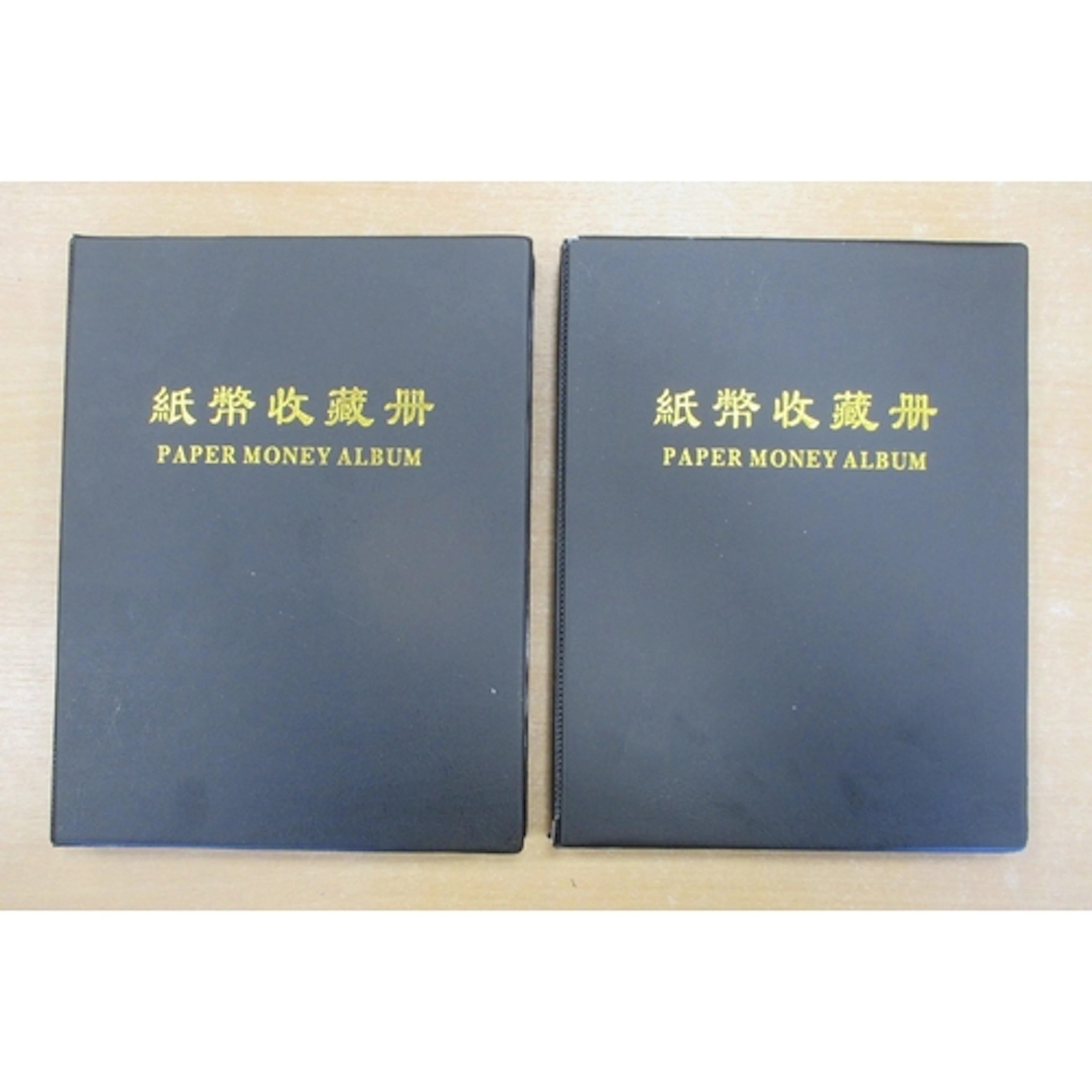 Collection of world banknotes in two albums, generally fine ...