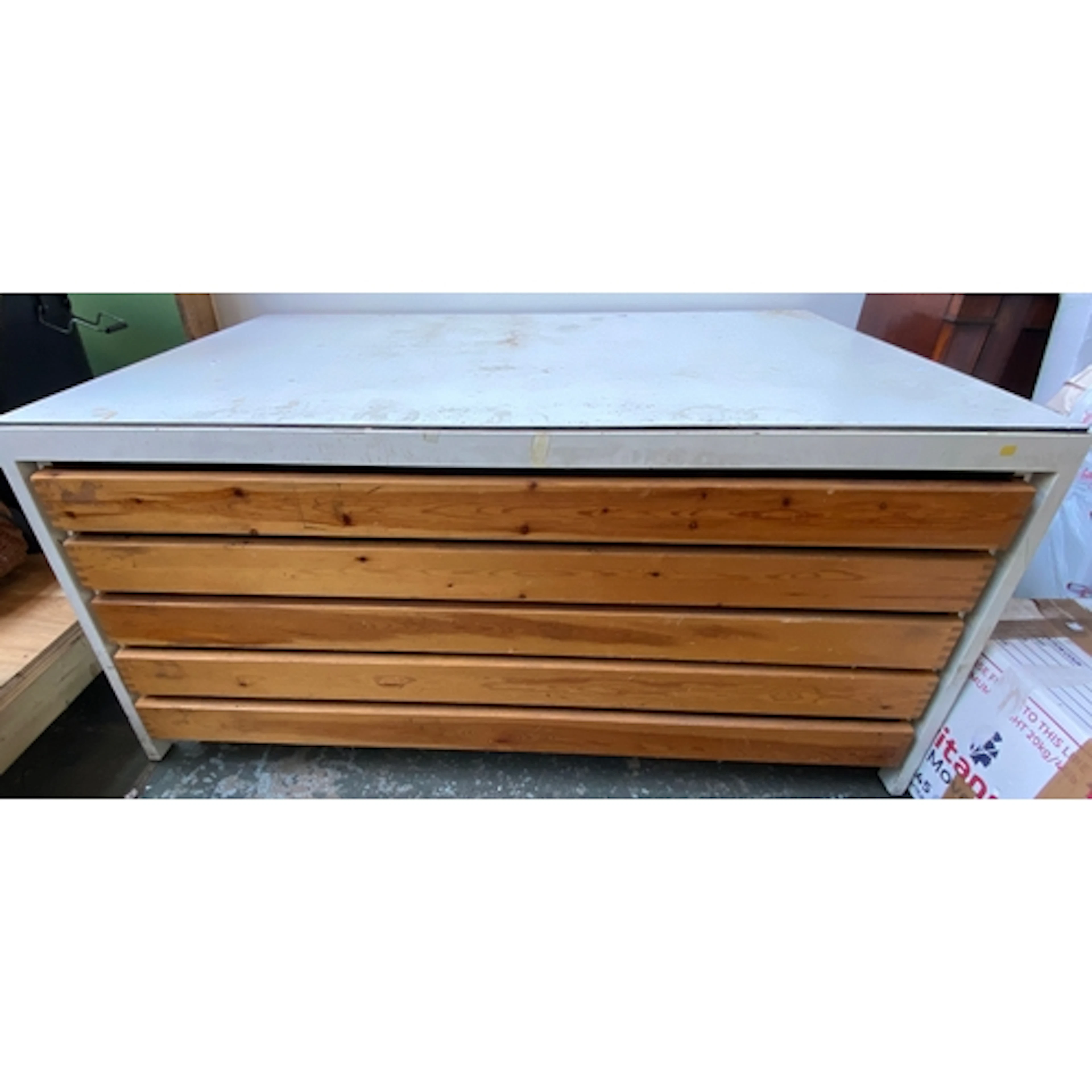 A metal industrial plan chest with formica top and five pine...