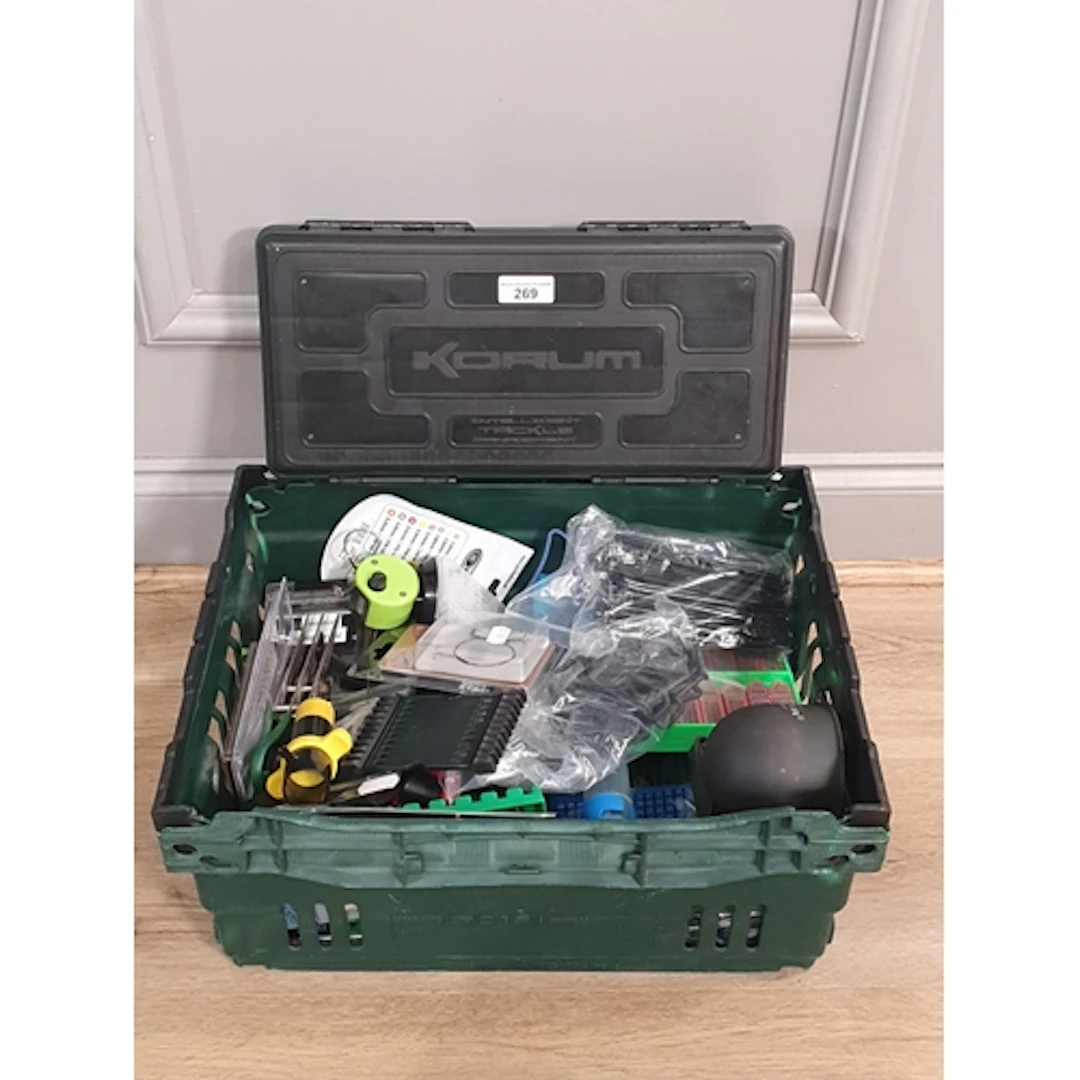 A Korum Intelligent Tackle Management Box containing assorte...