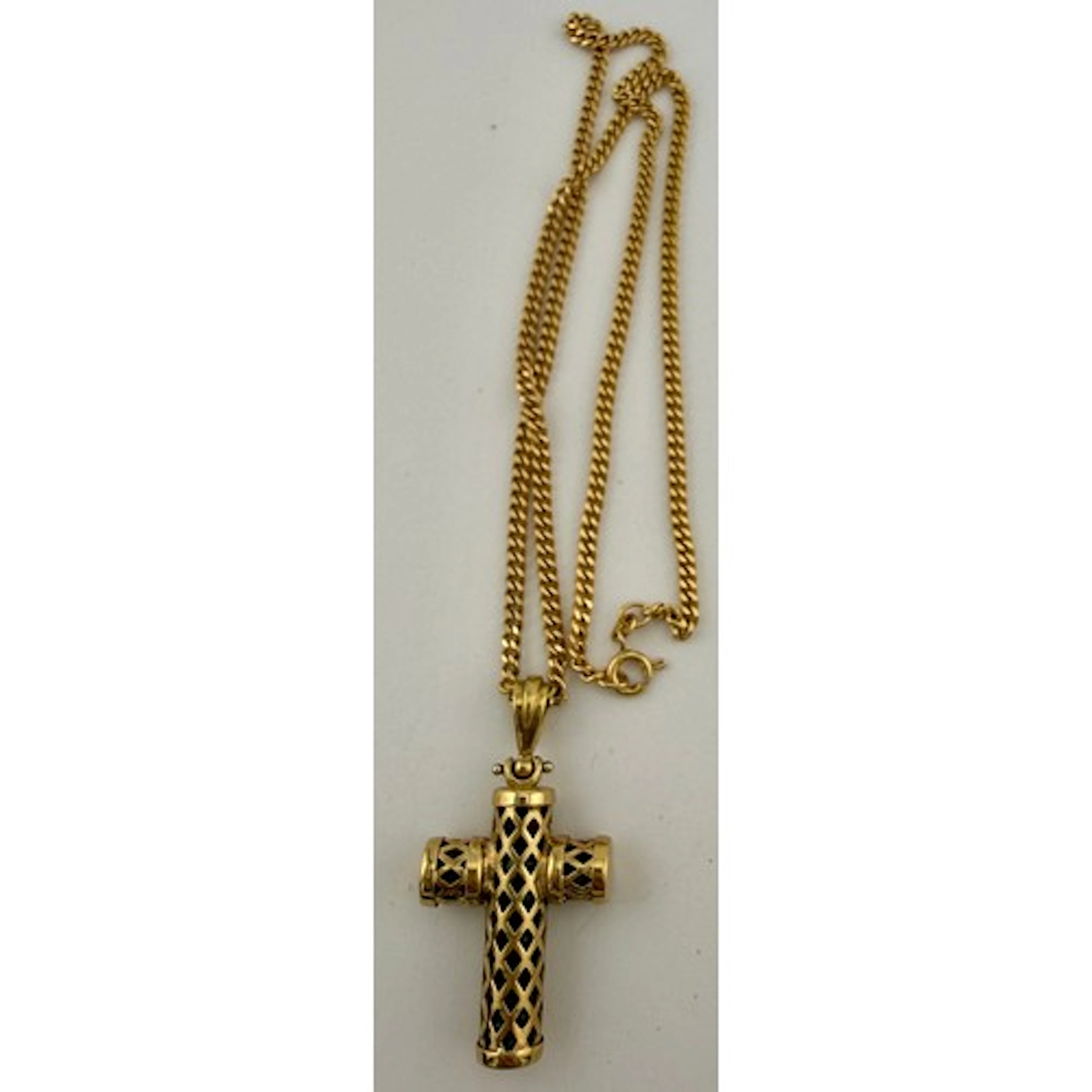 A 9 carat gold and pink glass crucifix suspended on a 9 cara...