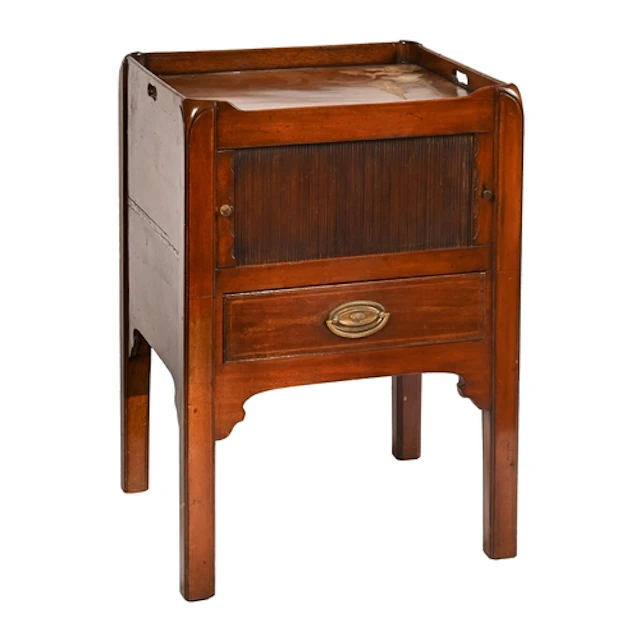 A George III mahogany tray top commode, with shutter and dra...