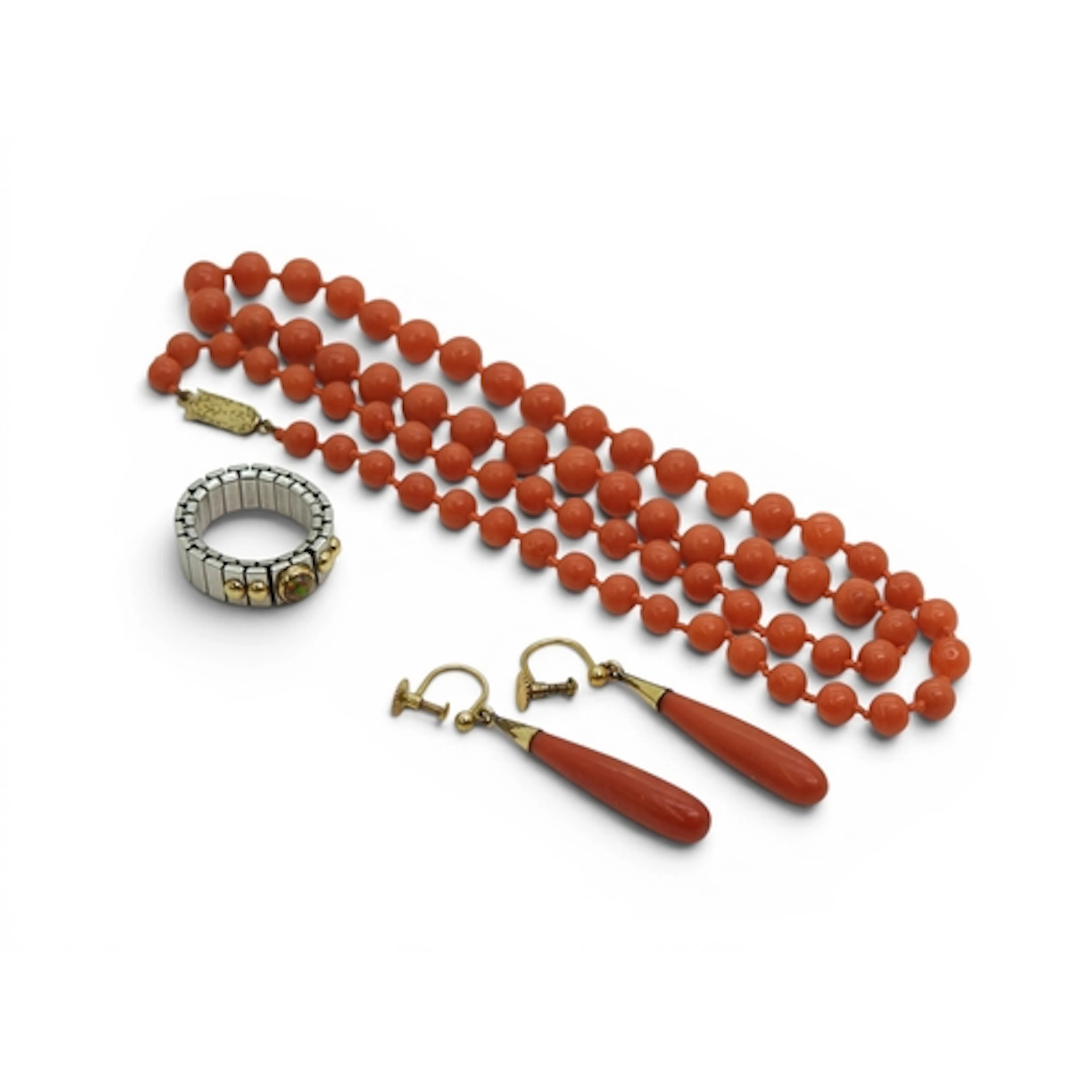 A string of coral beads with a 9ct gold clasp, length 56cm, ...