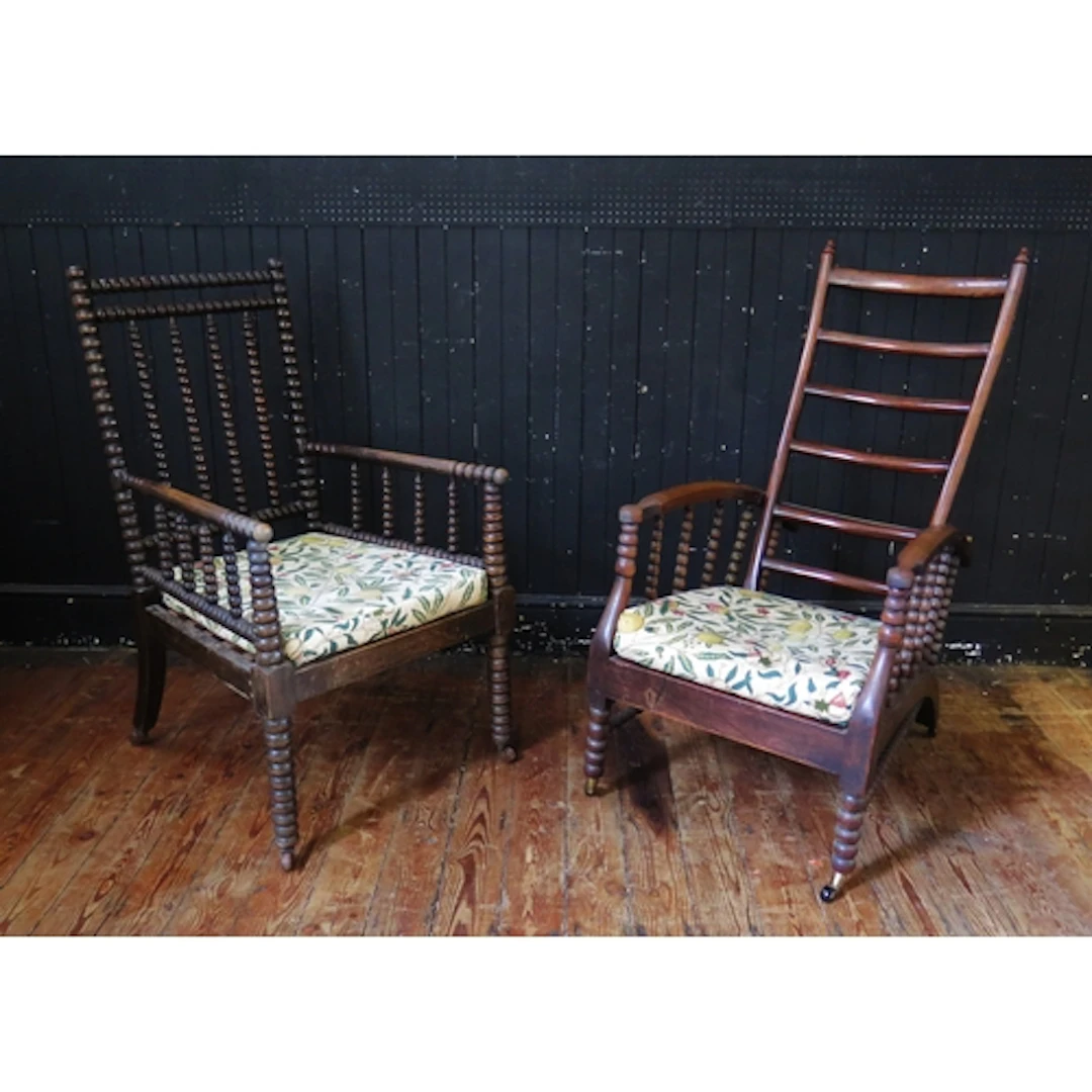 An Arts & Craft Period elm and beech easy chair, with reclin...