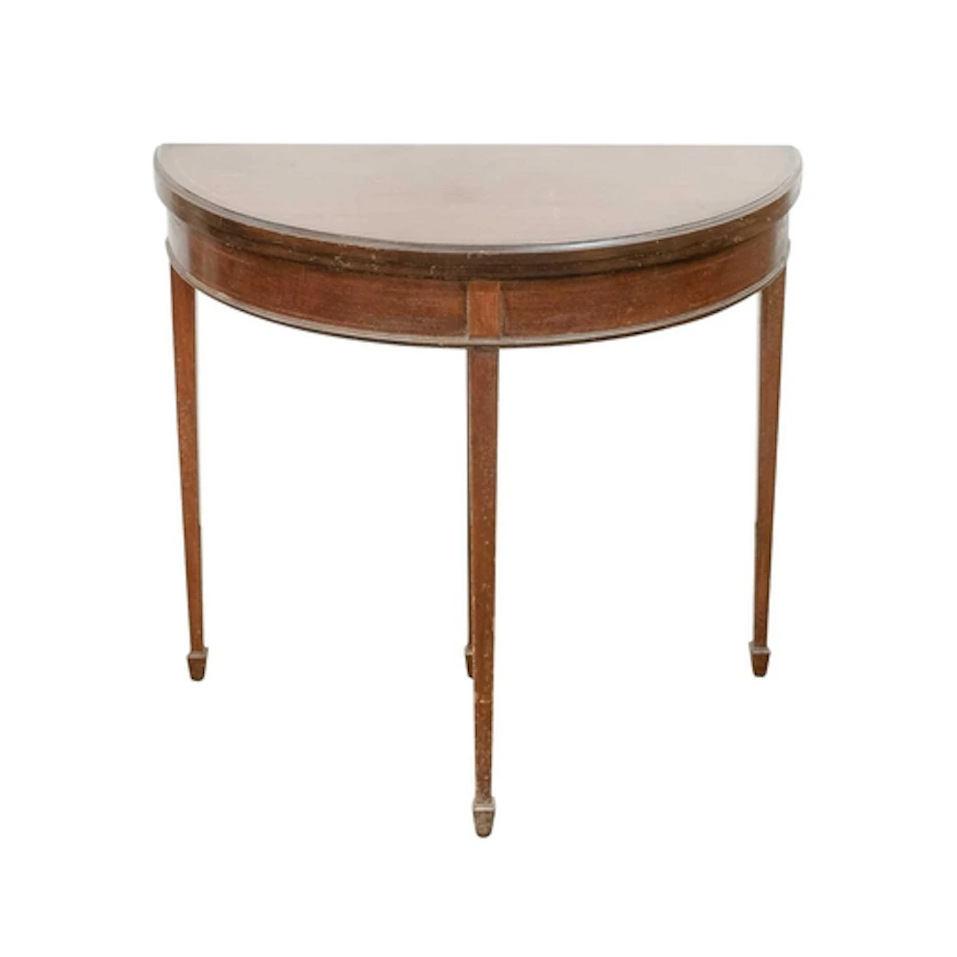 An Edwardian mahogany and inlaid half round fold top table. ...