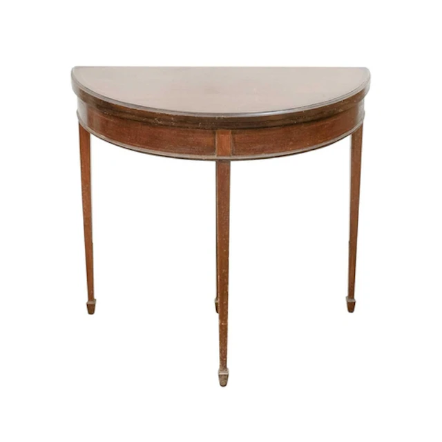 An Edwardian mahogany and inlaid half round fold top table. ...