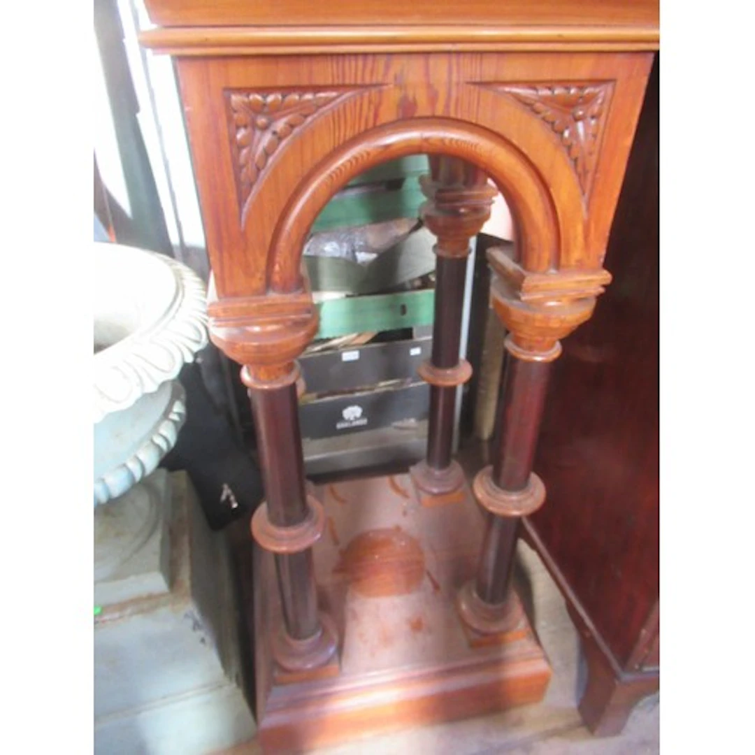 An ecclesiastical style pine plink of architectural form